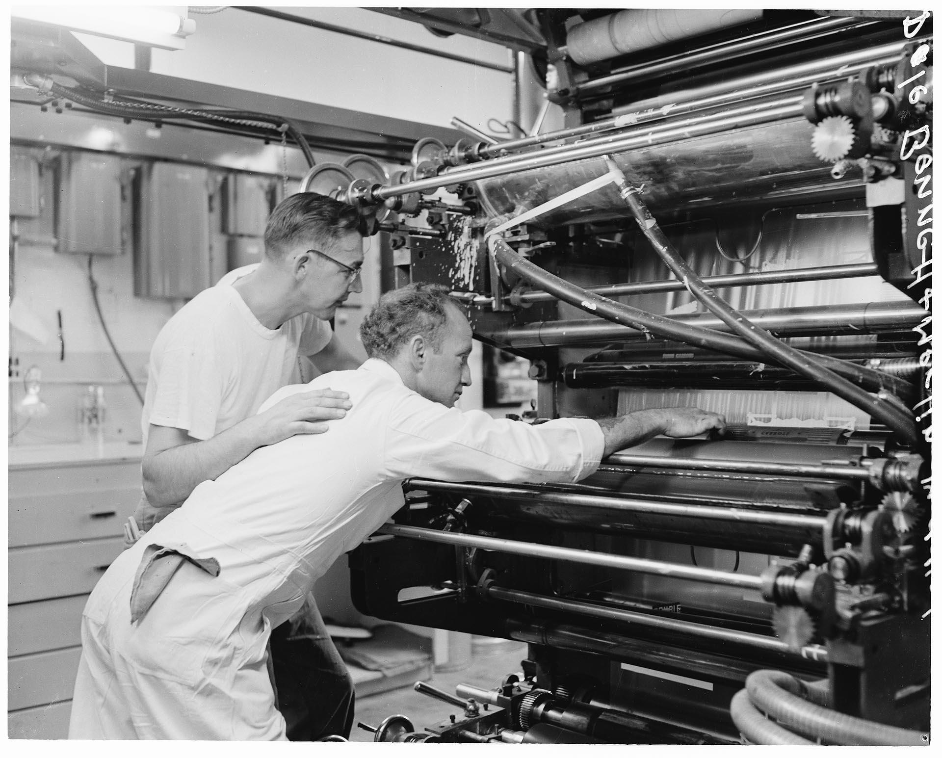 Image of Workers operating color press at Cello Bag Co., Seattle, July 1955
