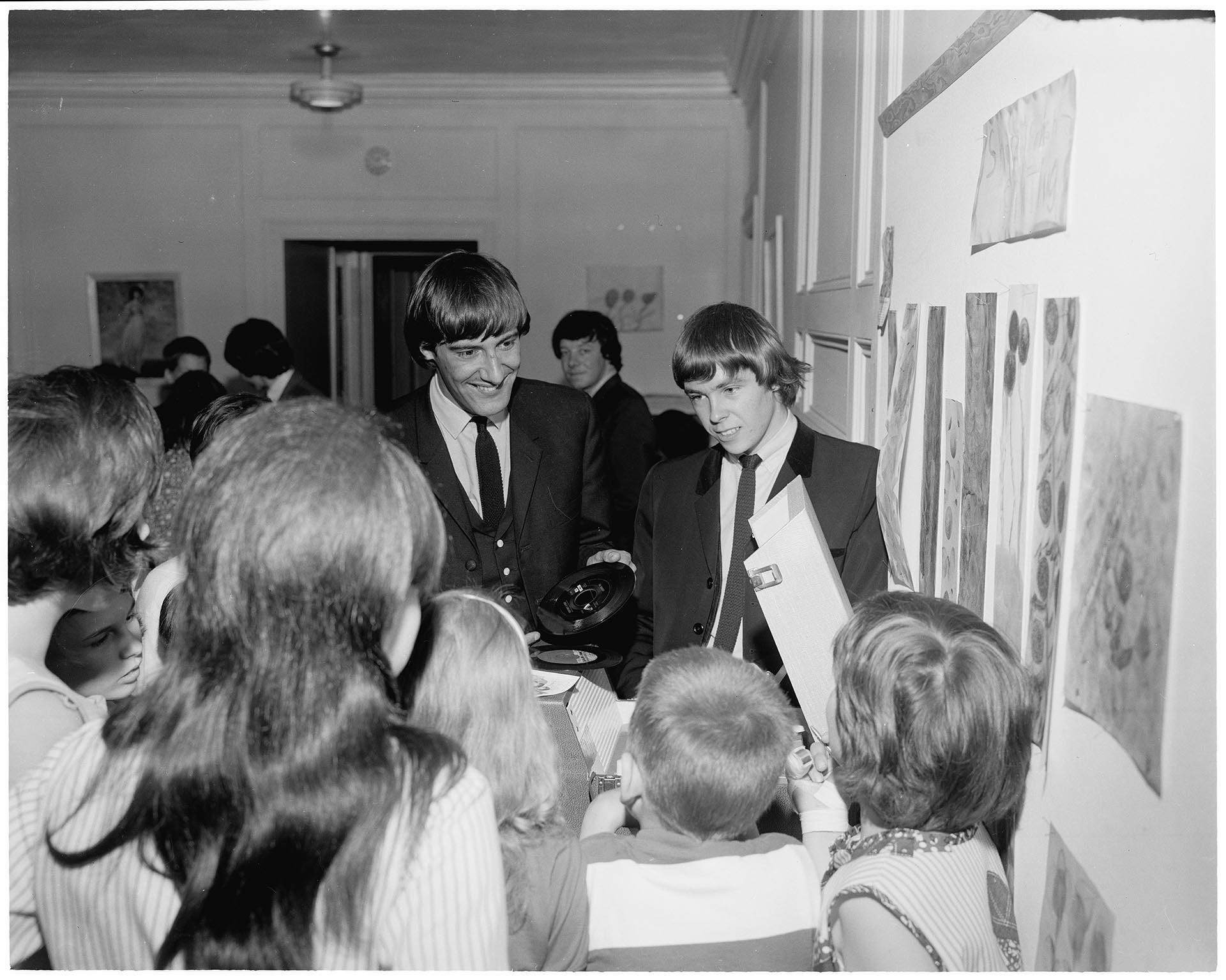 Image of Children surrounding Liverpool Five at Seattle Children's Home, June 1965