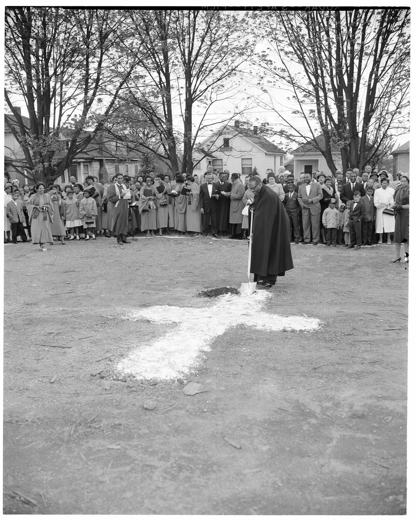 Image of Pastor McKinney breaking ground for church addition, Seattle, April 28, 1962