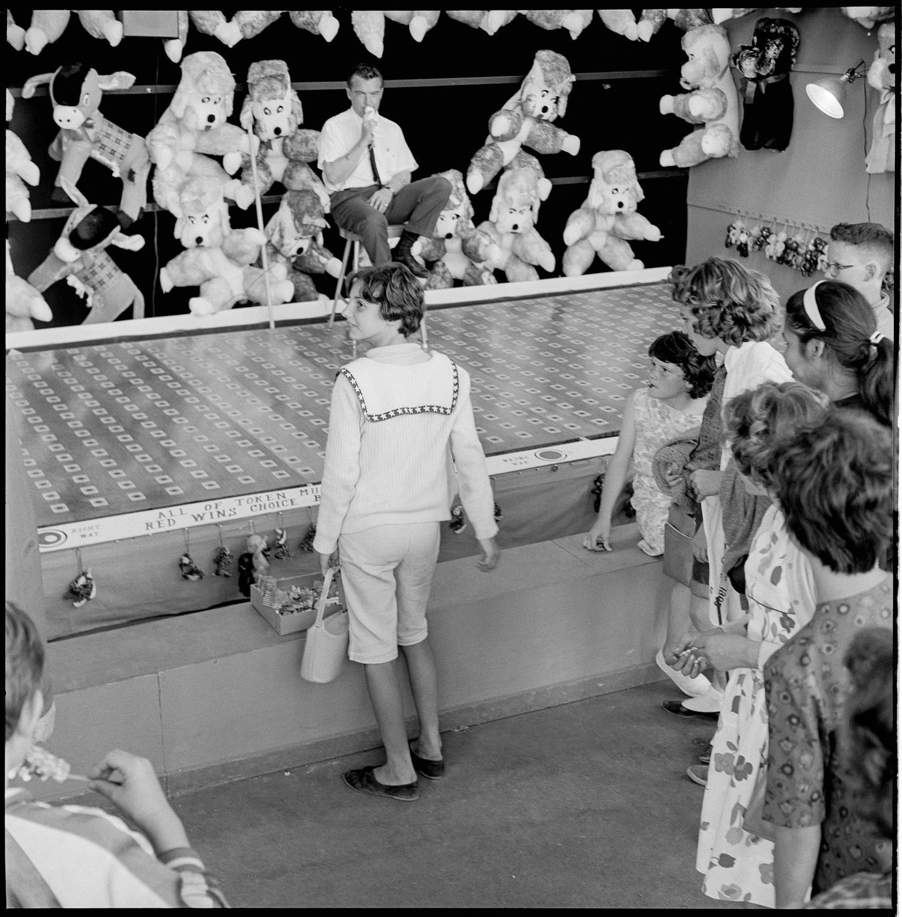 Image of Children watching carnival game at Fun Forest, Seattle Center, June 1963