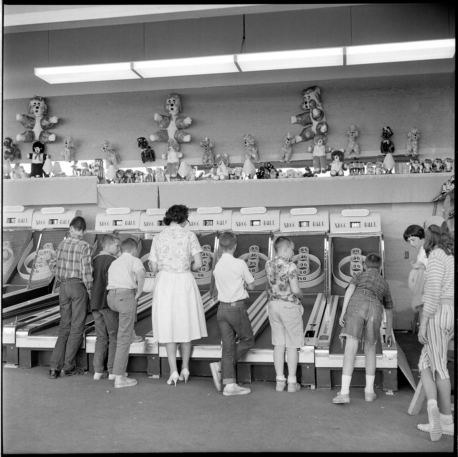 Image of People playing carnival game at Fun Forest, Seattle Center, June 1963