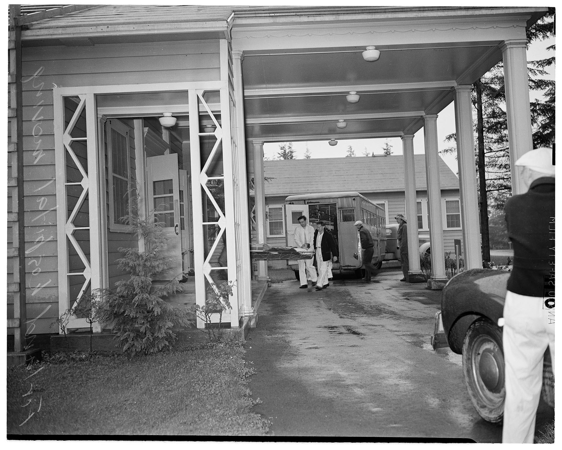Image of Attendants unloading patients at Firland Sanatorium, Seattle, November 25, 1947