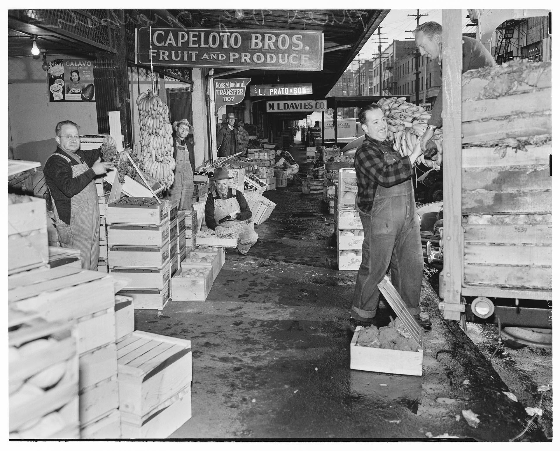 Image of Capeloto brothers unloading fruit at market, Seattle, November 4, 1948