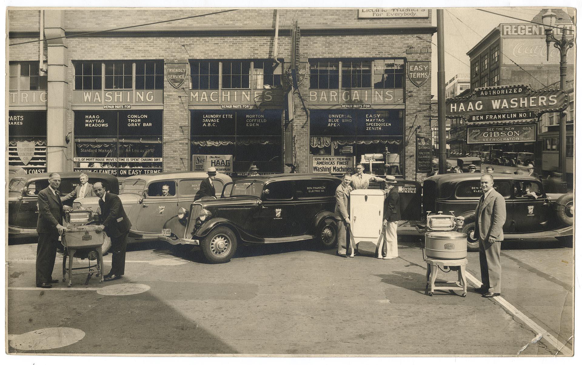 Image of Salesmen with appliances outside Ben Franklin Electric Company, Seattle, circa 1935
