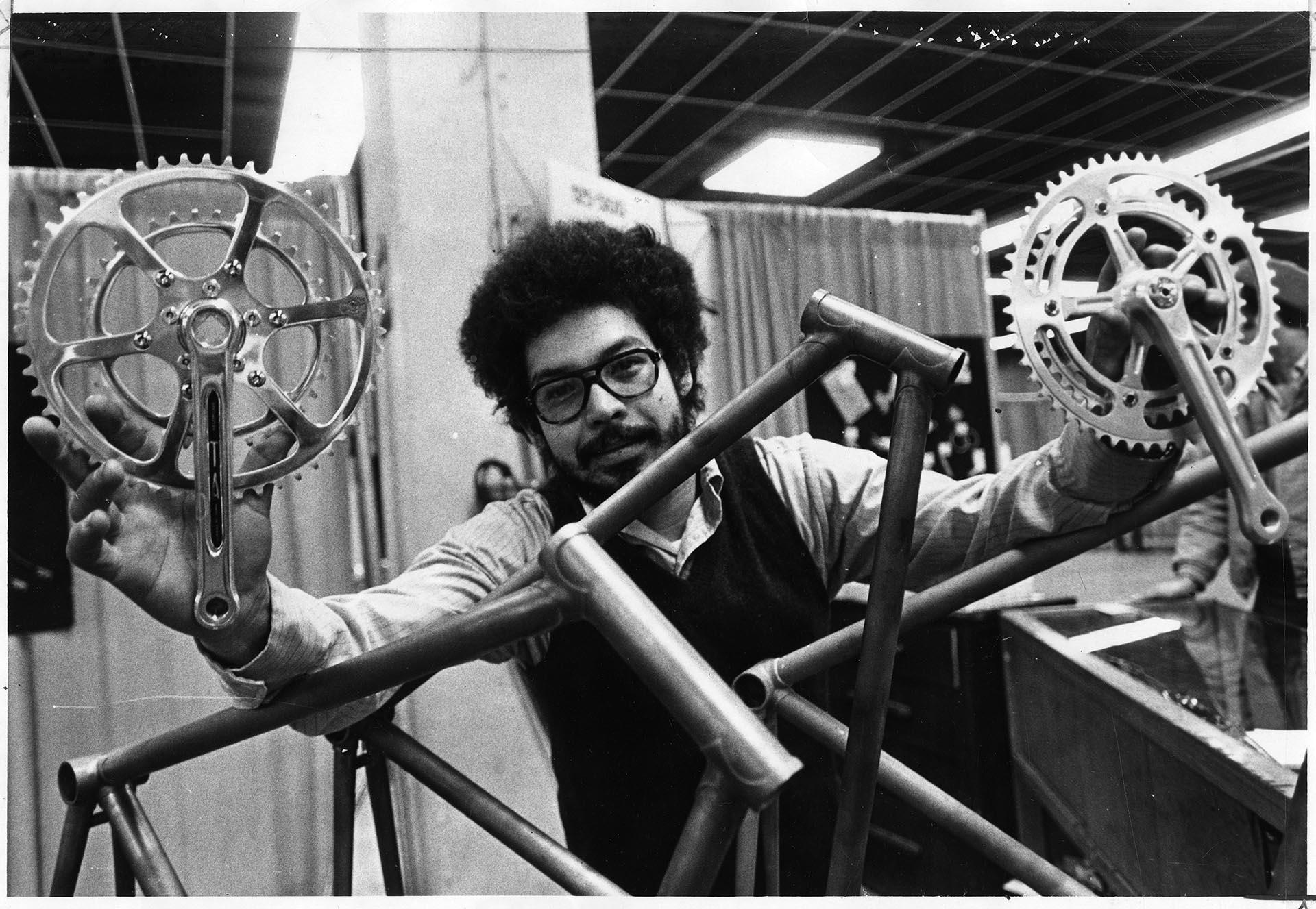 Image of Angel Rodriquez with bicycle frame at R&E Cycles, Seattle, May 10, 1974
