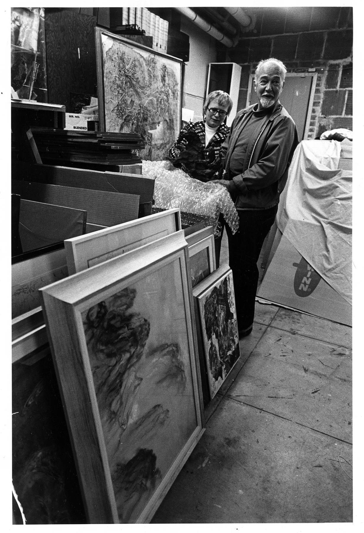Image of Kenneth Callahan and his wife Beth with paintings, Seattle, March 19, 1973