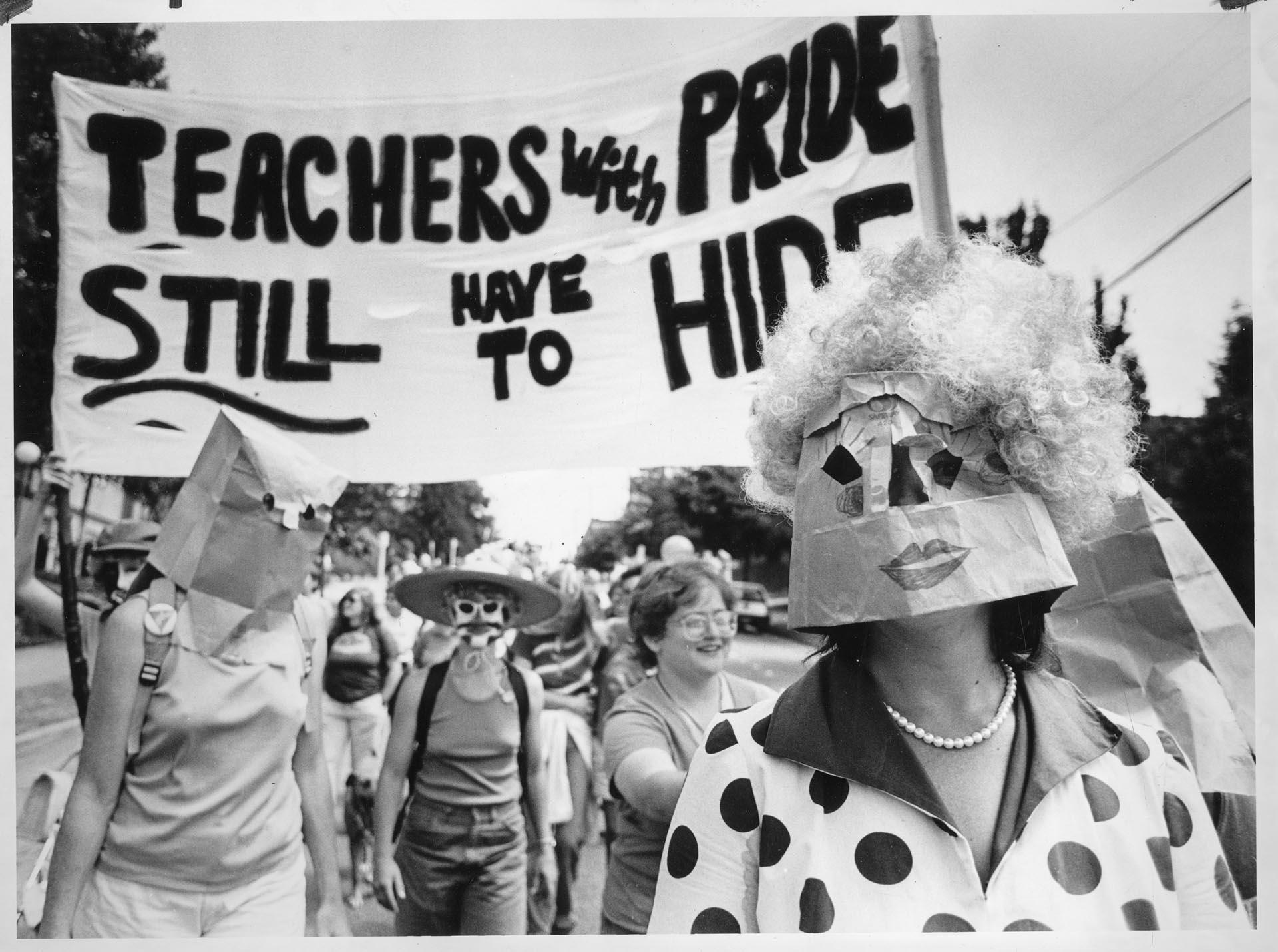 Image of Gay schoolteachers wearing masks at parade, June 28, 1986