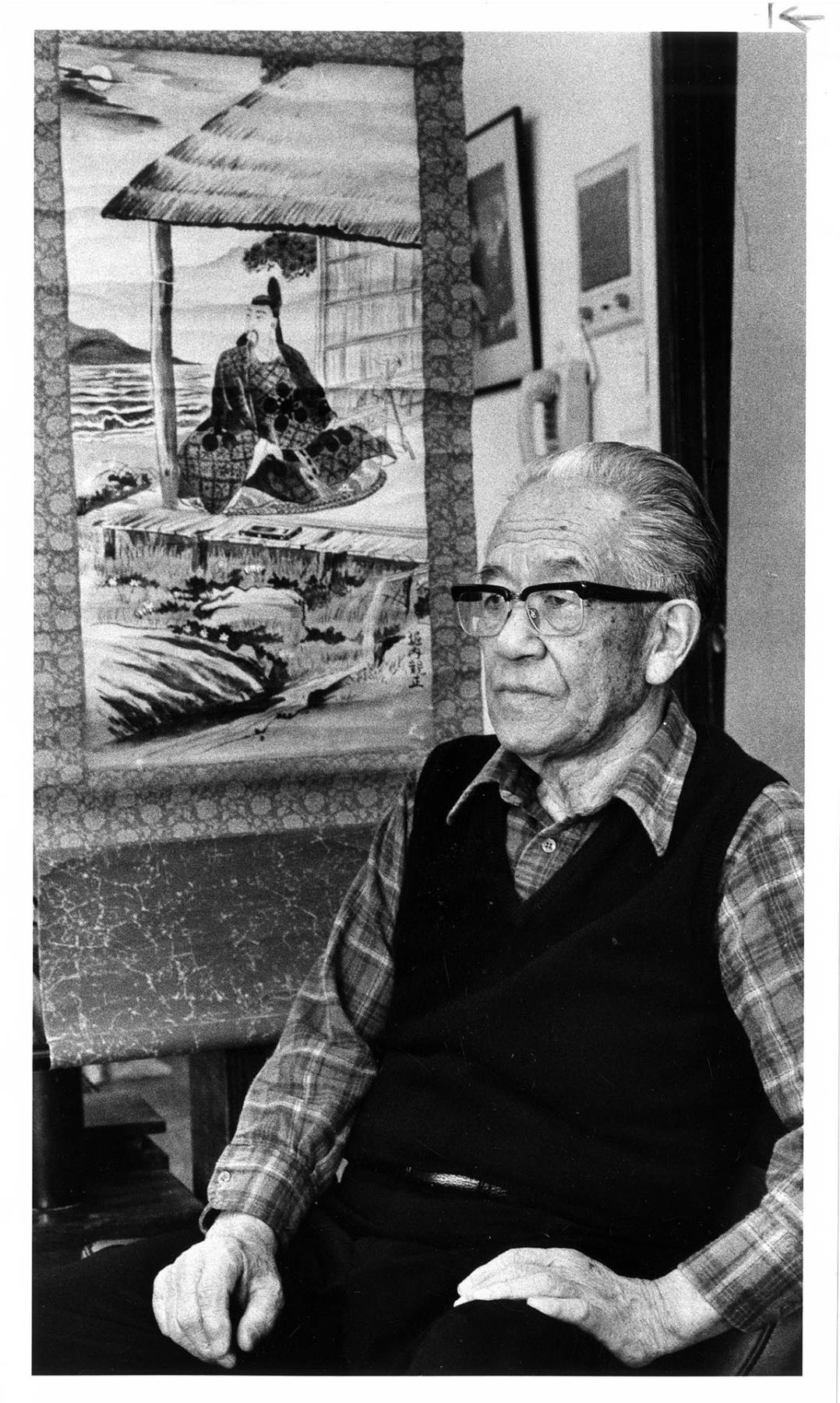 Image of Paul Horiuchi with Japanese scroll, Seattle, March 18, 1983