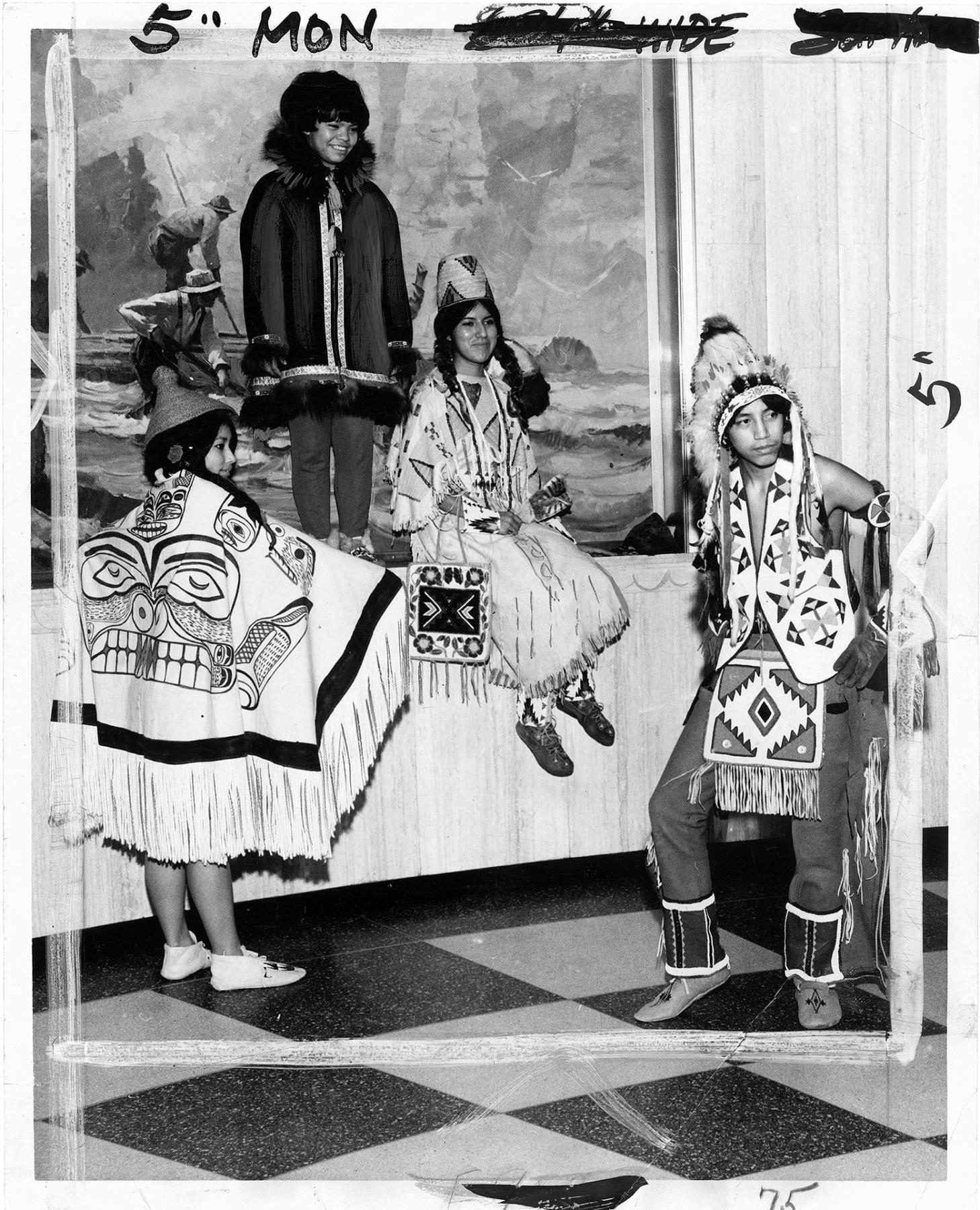 Image of Four Native youth in traditional dress, March 14, 1966