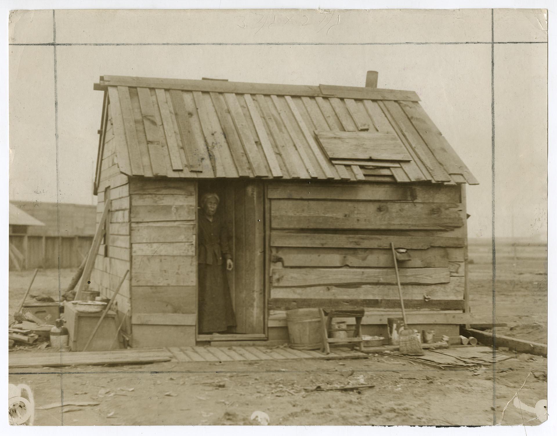 Image of Ellen Phillips in doorway of her home, Seattle, May 10, 1910