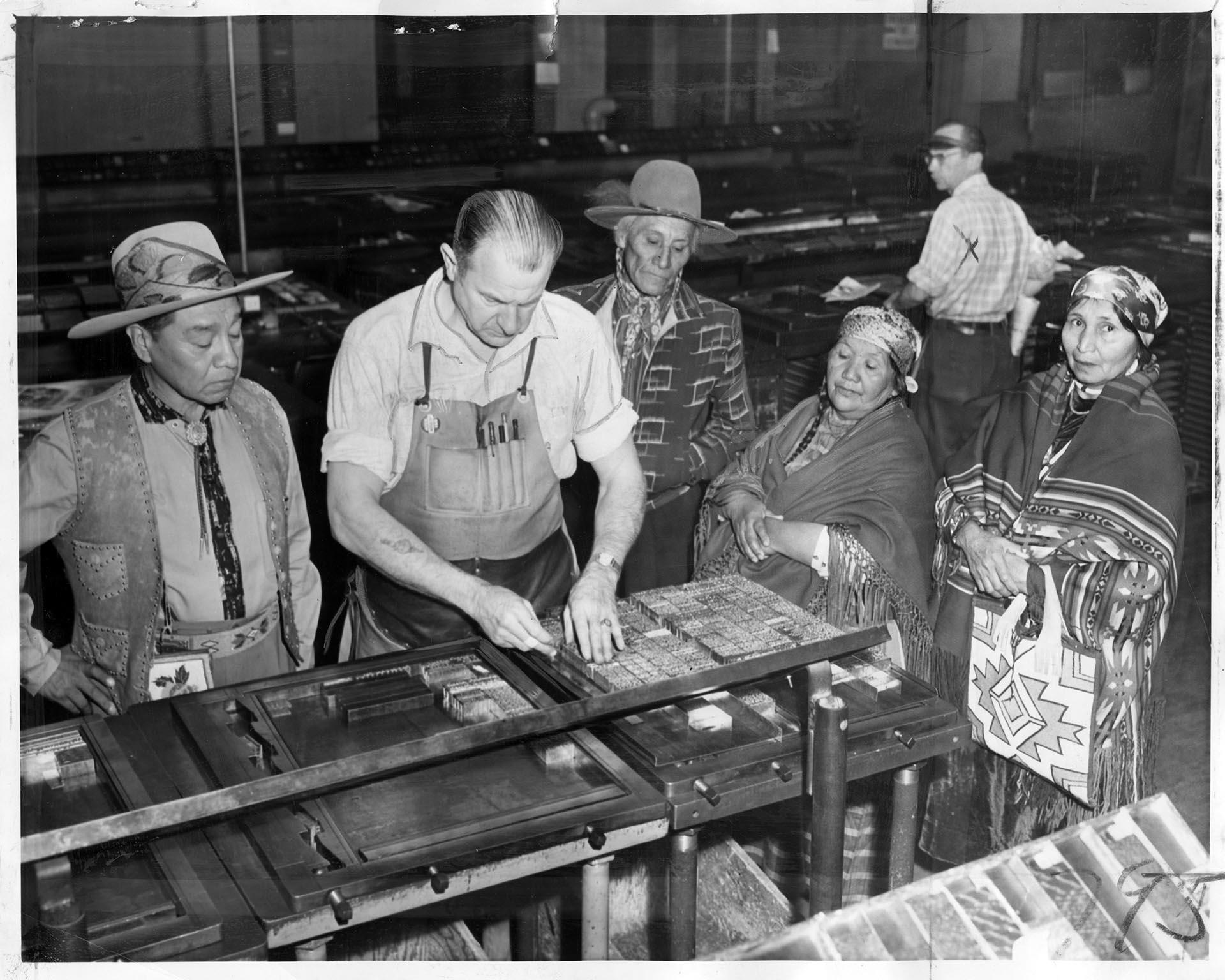 Image of Wanapum visitors in the Seattle Post-Intelligencer composing room, Seattle, October 1956
