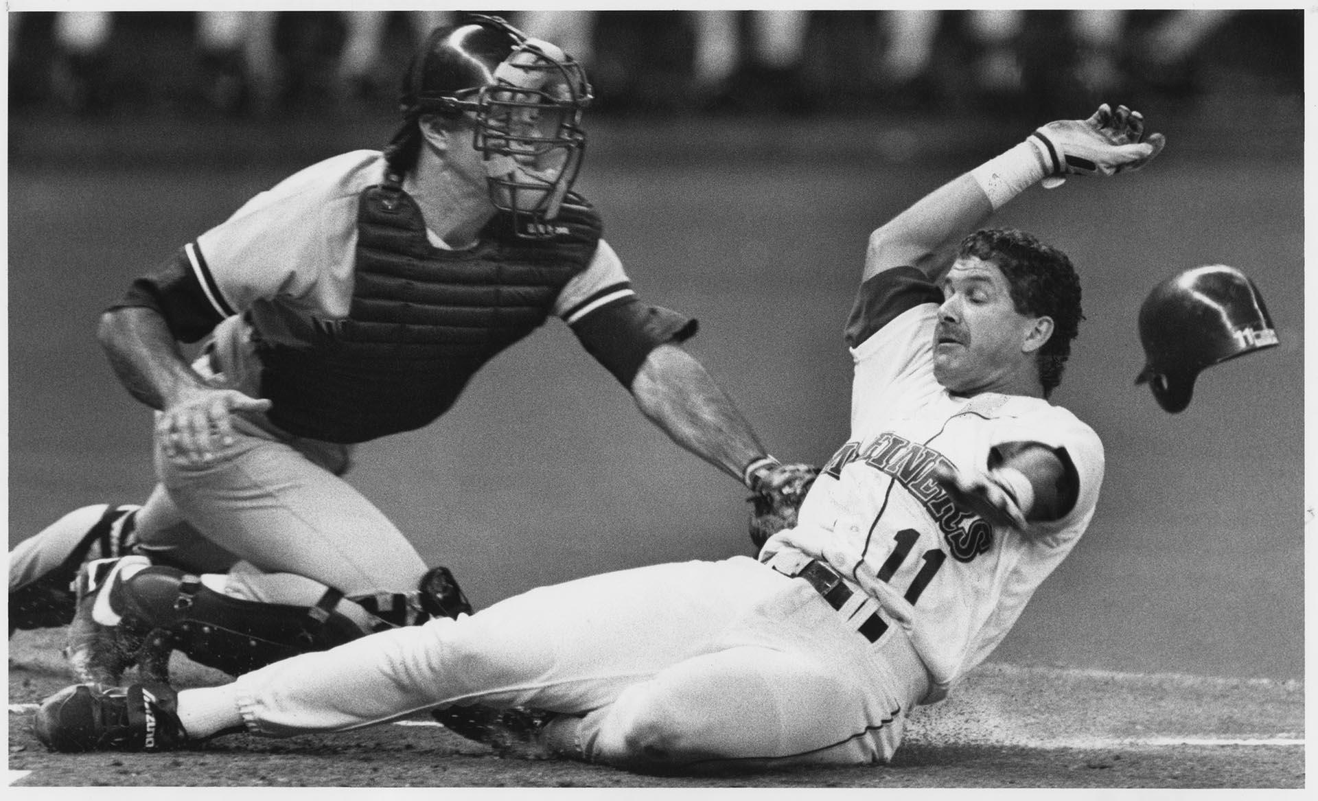 Image of Edgar Martinez sliding past Matt Nokes, Seattle, July 16, 1991
