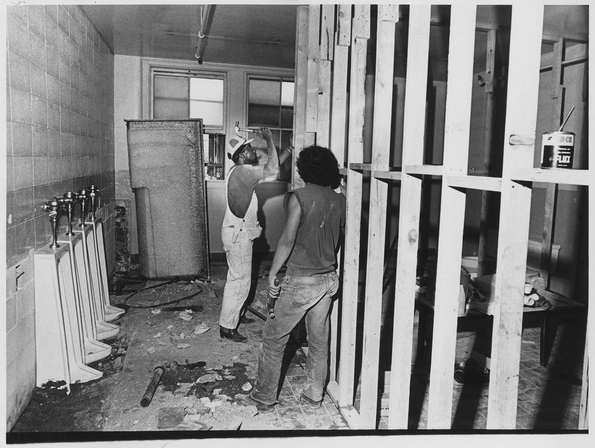 Image of Carpenters renovating bathrooms at Centro de la Raza, August 2, 1973