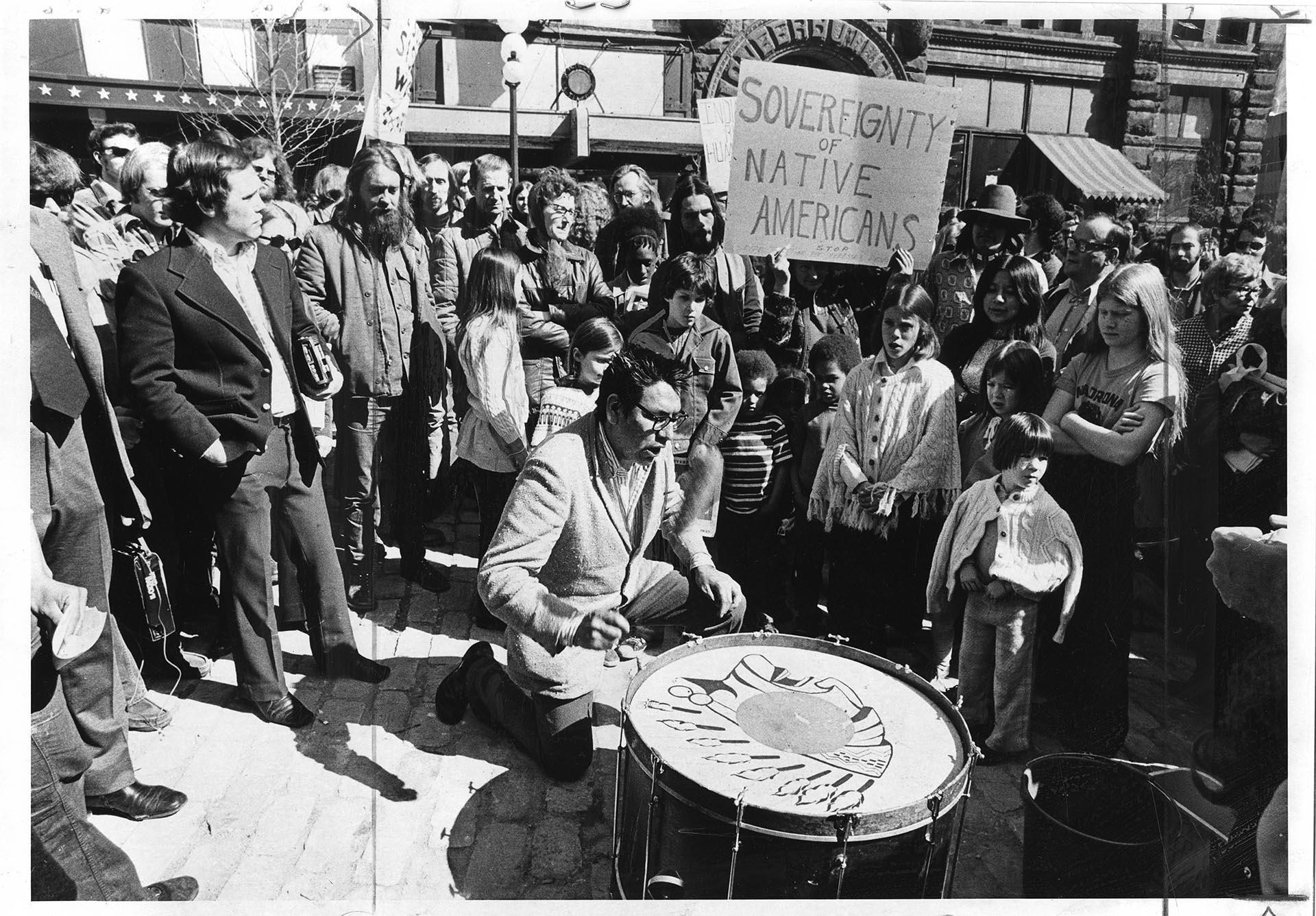 Image of Bernie Whitebear drumming at Wounded Knee support rally, Seattle, March 24, 1973