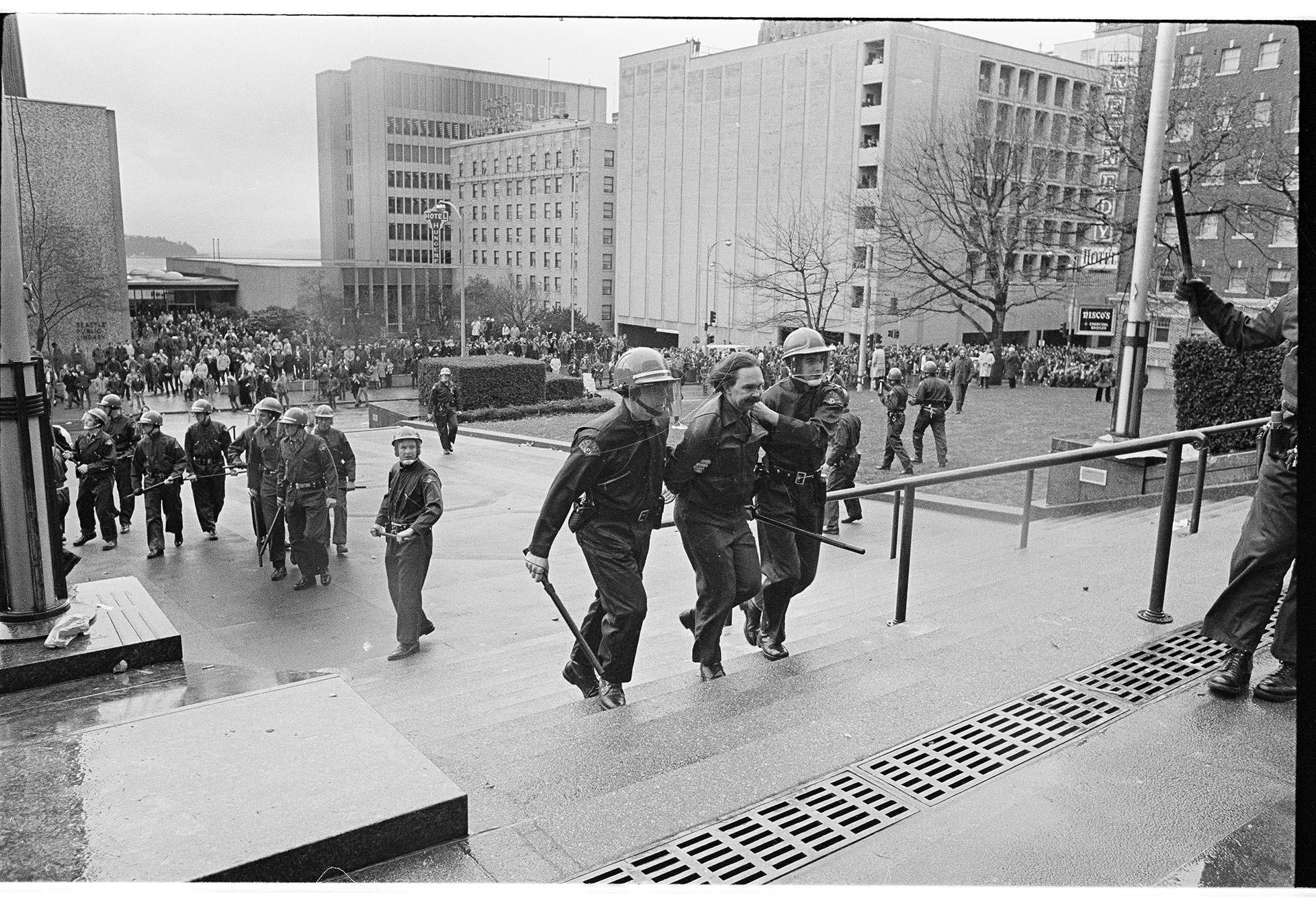 Image of Police detaining a demonstrator at the Federal Courthouse, Seattle, February 17, 1970