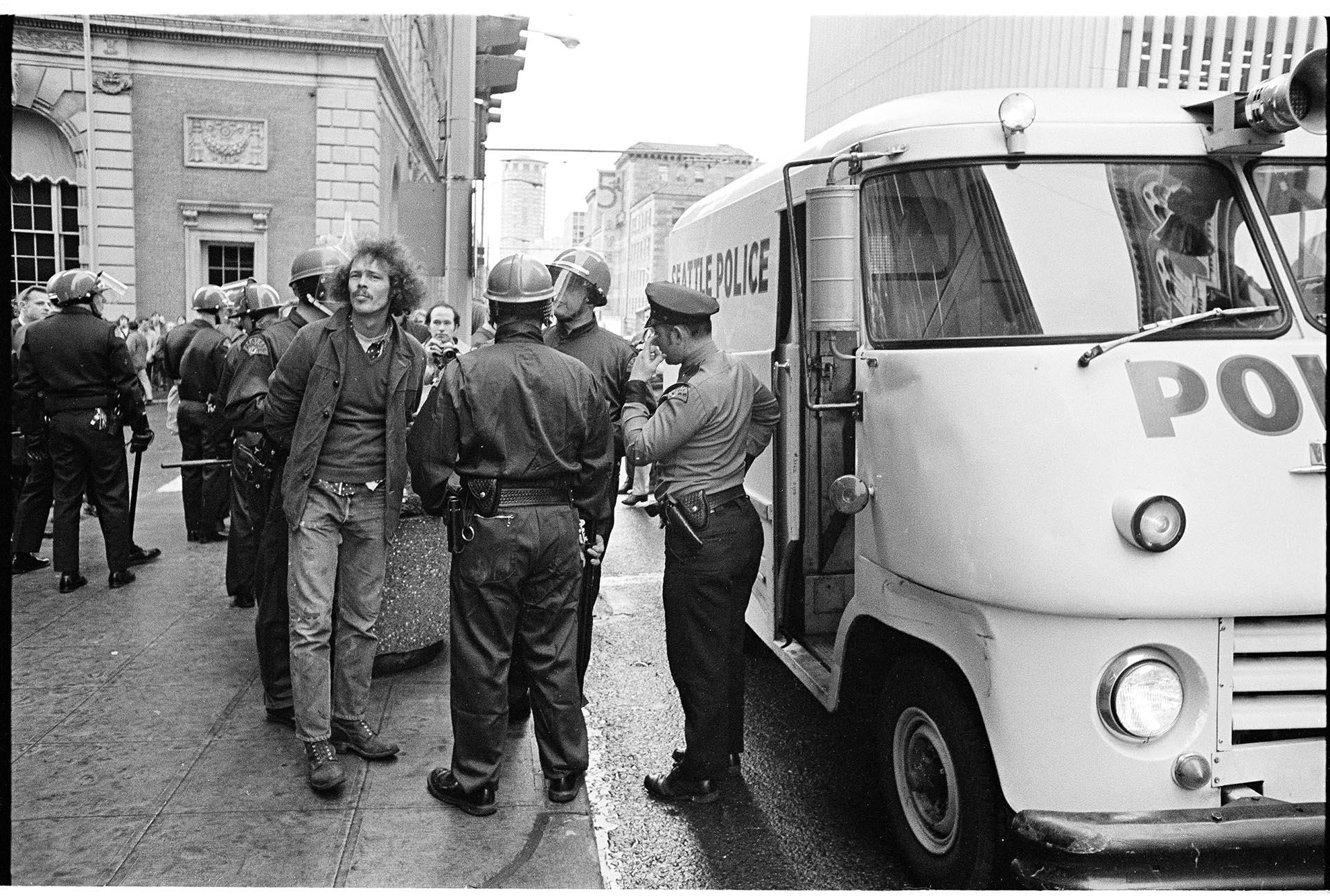 Image of Demonstrator detained on Fifth Avenue, Seattle, Feb 17, 1970