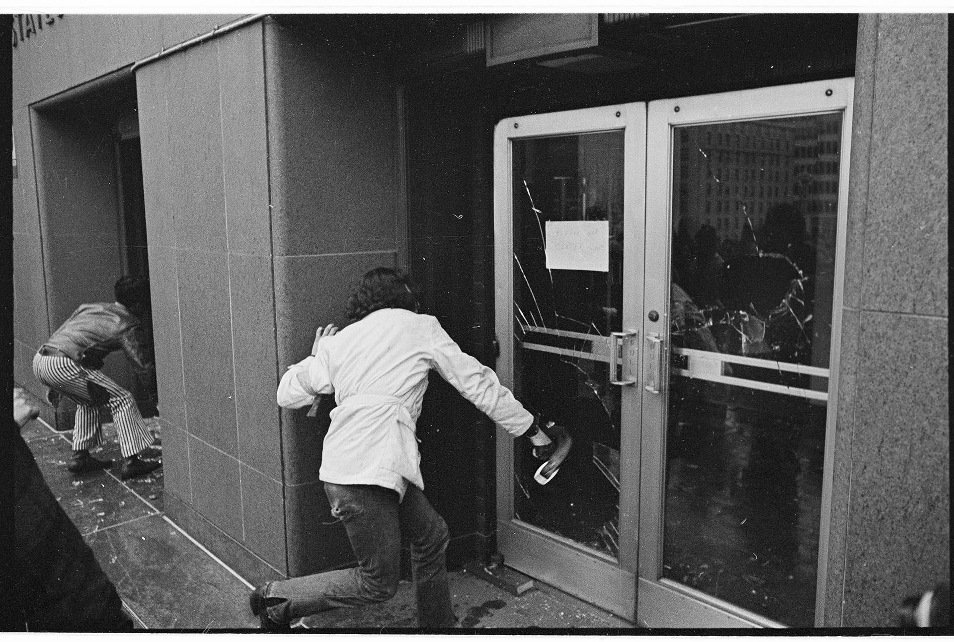 Image of Protesters breaking glass door at Courthouse, February 17, 1970