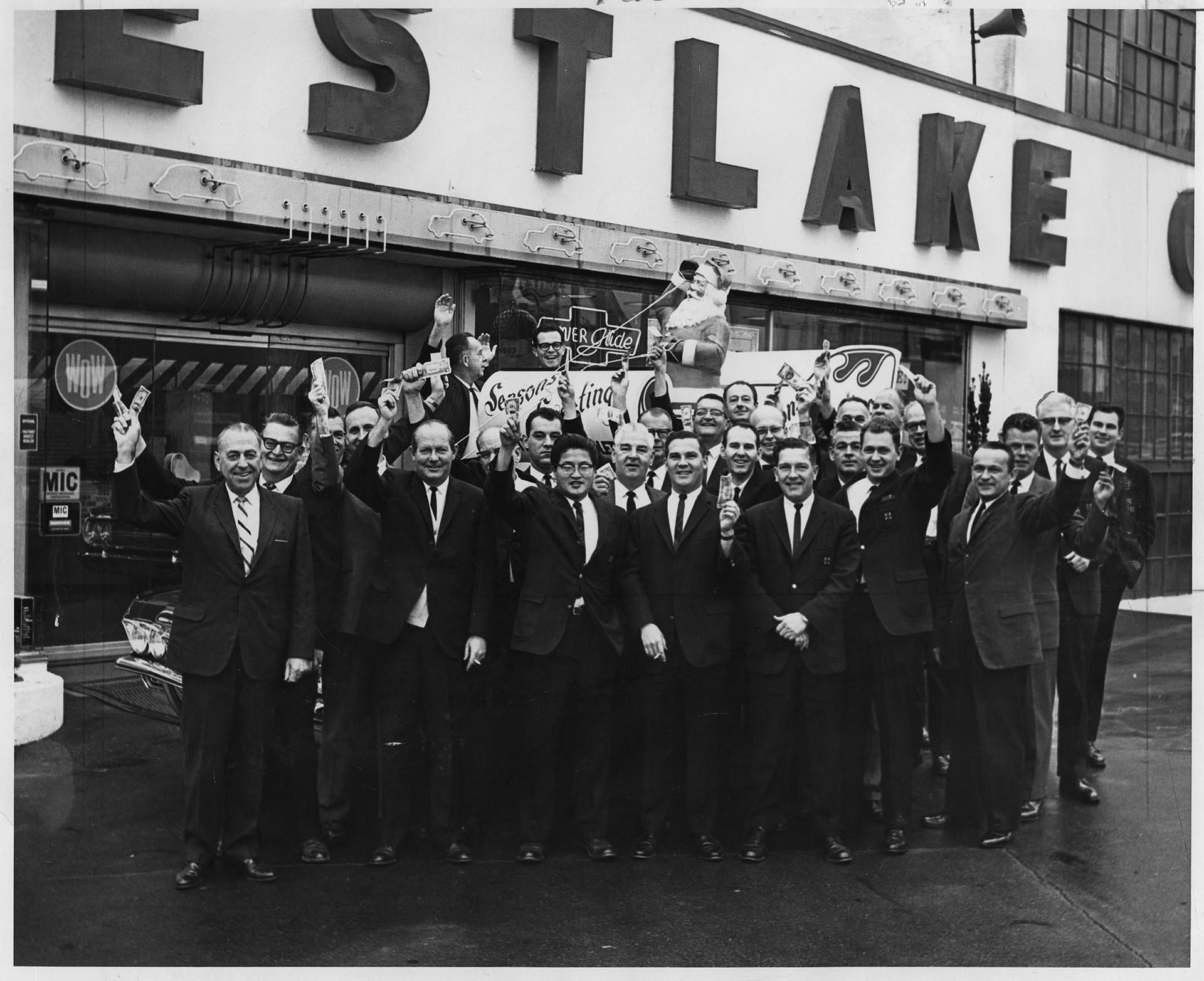 Image of Westlake Chevrolet Co. staff outside dealership, November 13, 1964