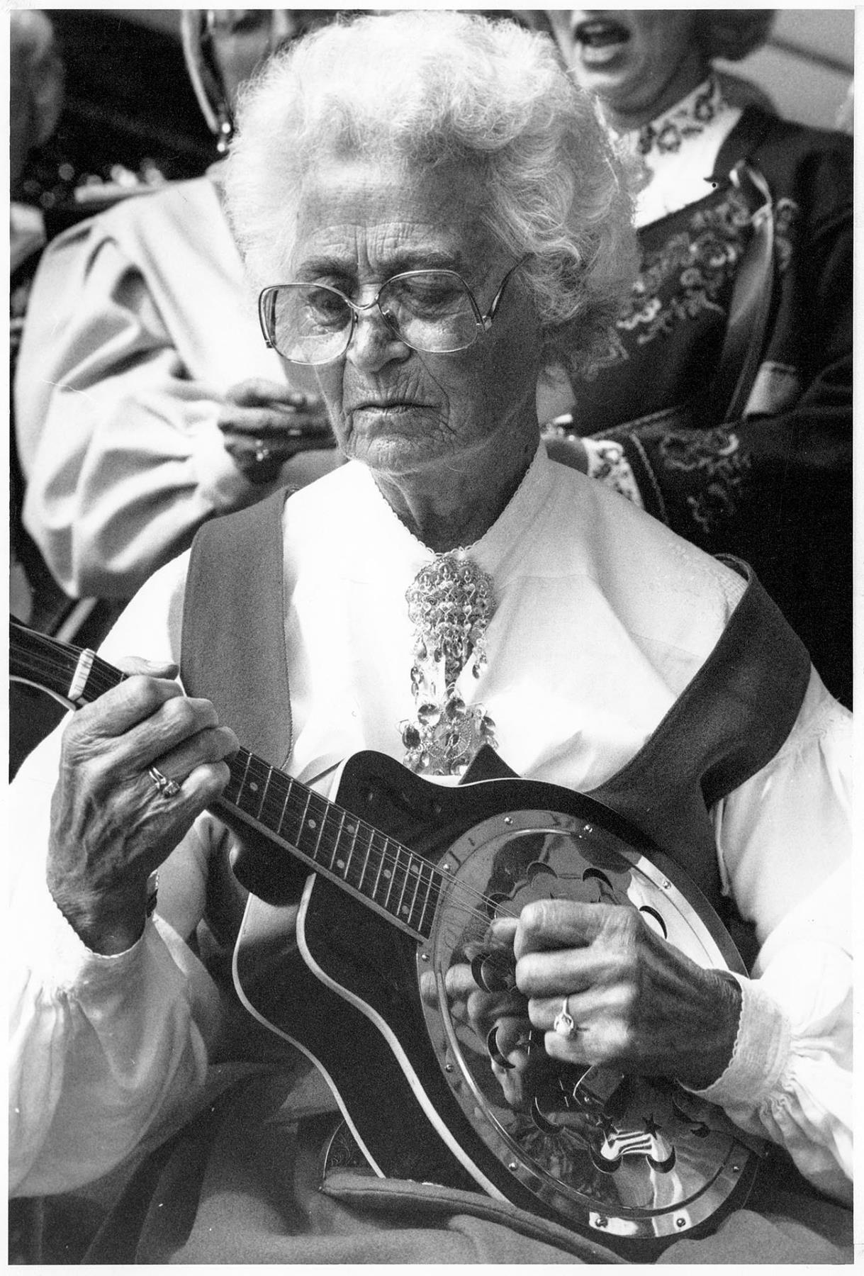 Image of Laila Peterson with mandolin at Syttende Mai, Seattle, May 17, 1988