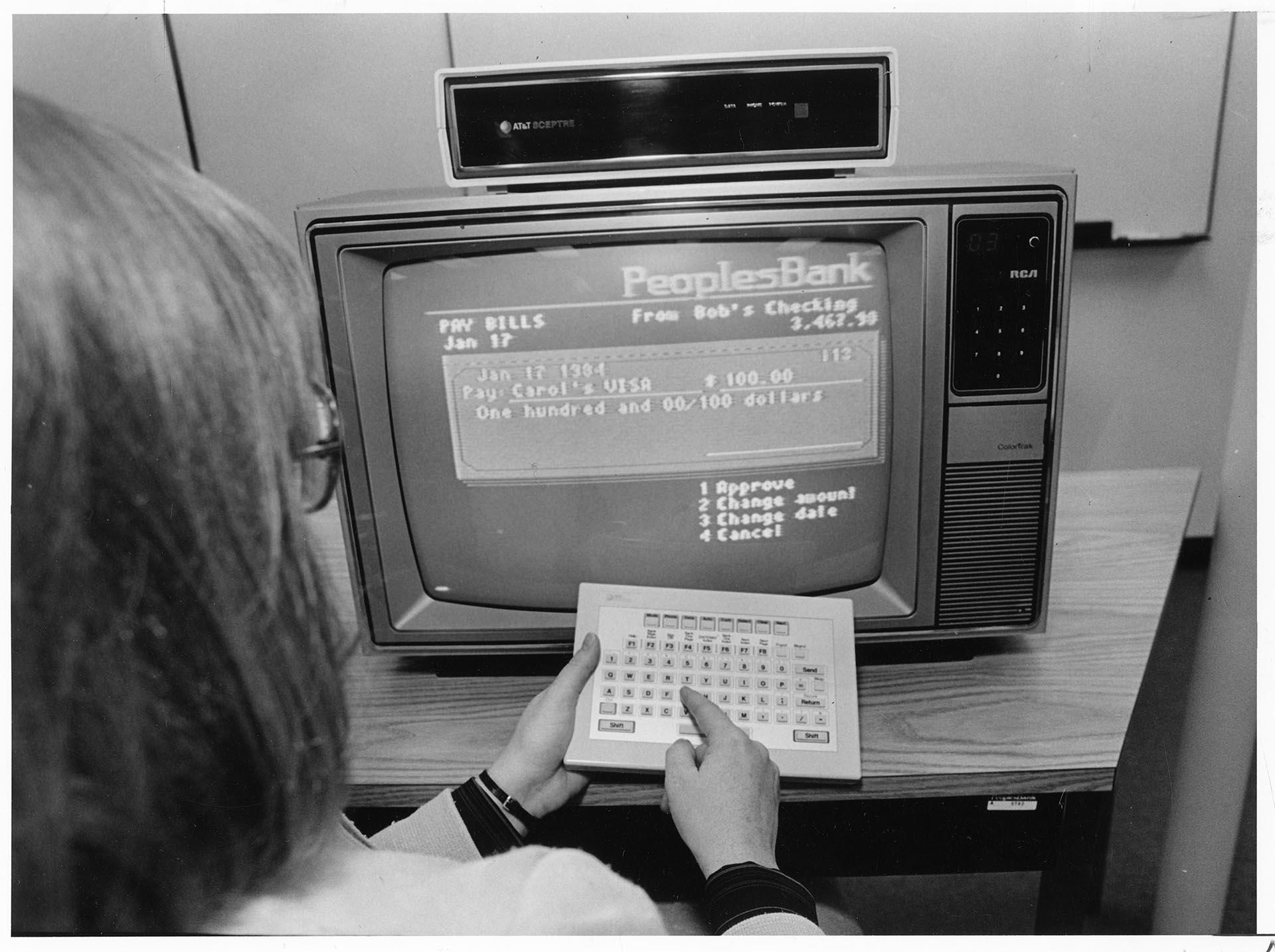 Image of Woman using Peoples Bank home banking program, September 20, 1984