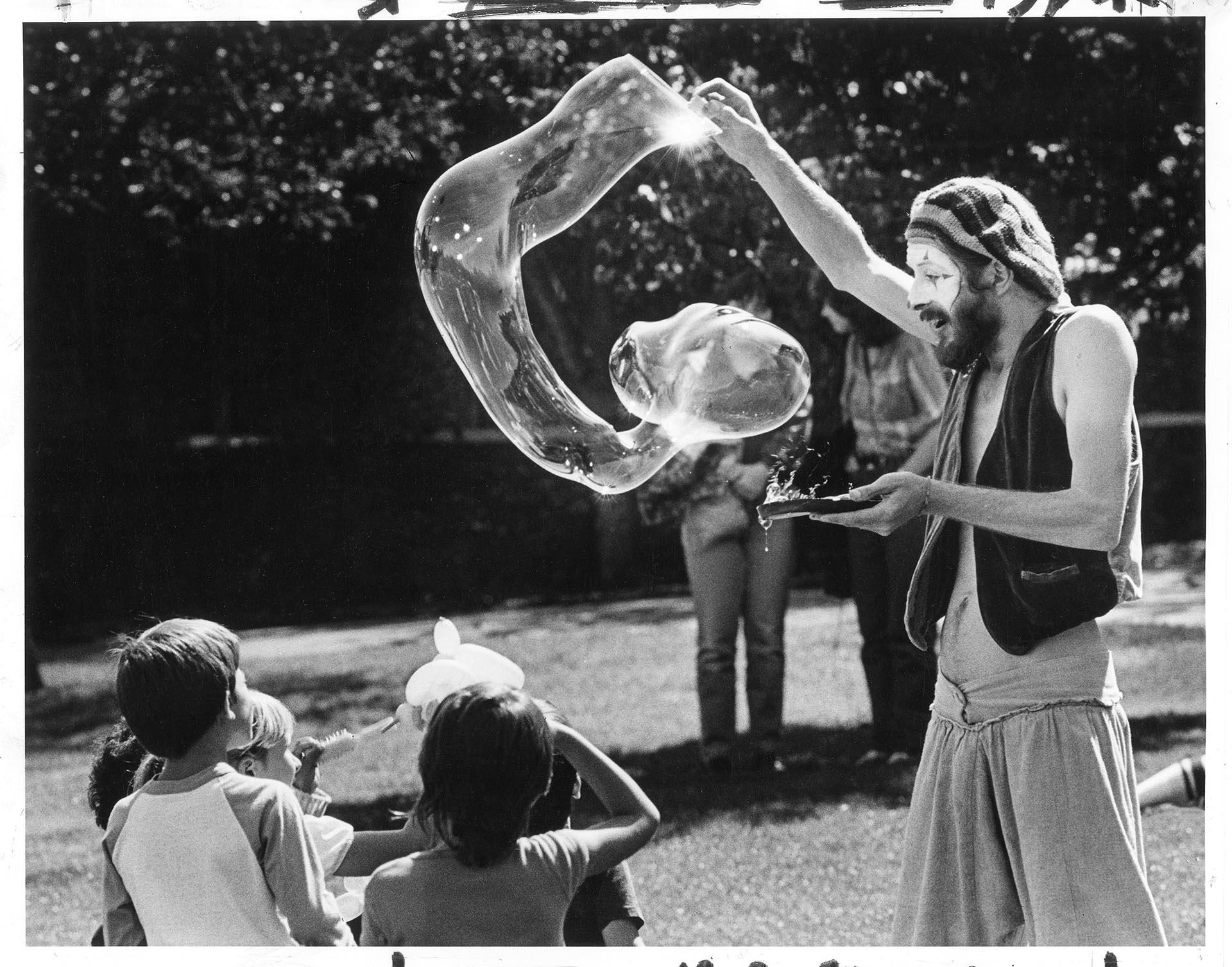 Image of Clown making bubbles at Bumbershoot, Seattle, September 2, 1984