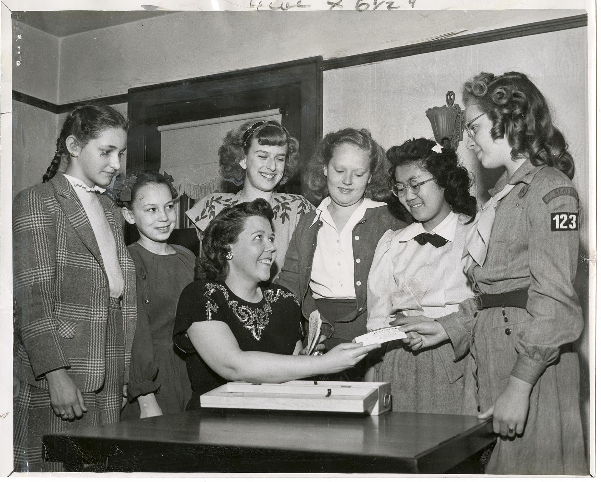 Image of Do Good Club members receiving tickets, Seattle, March 18, 1948