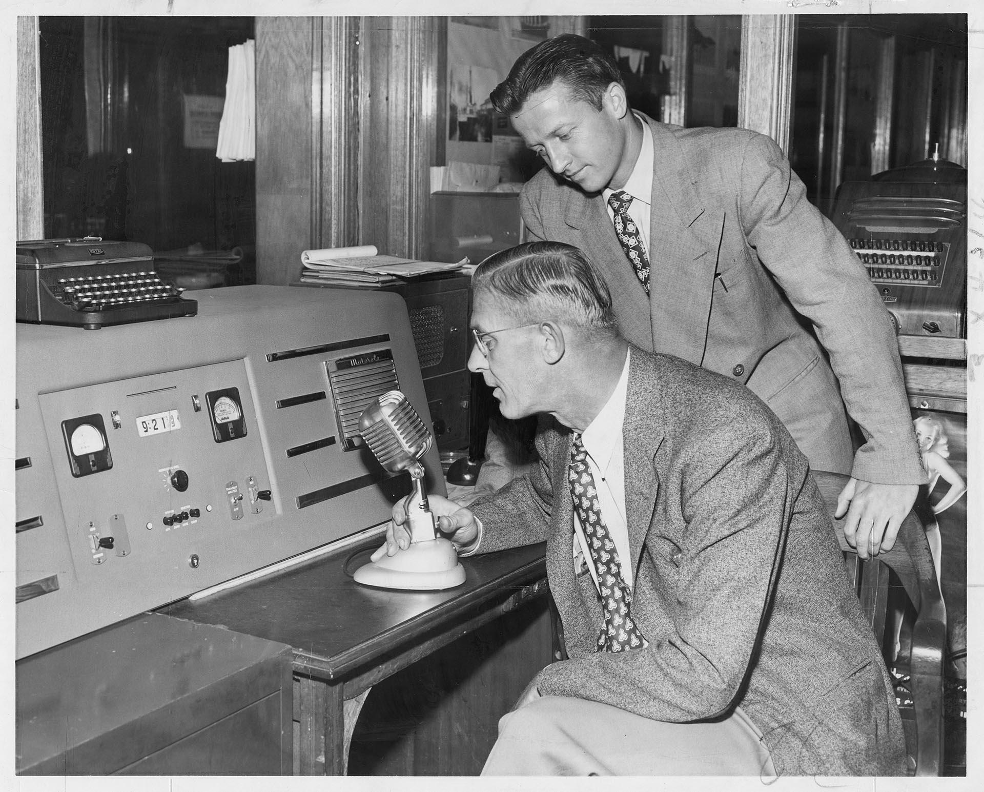 Image of Land-based dispatchers calling tug boat captain, Seattle, June 11, 1949