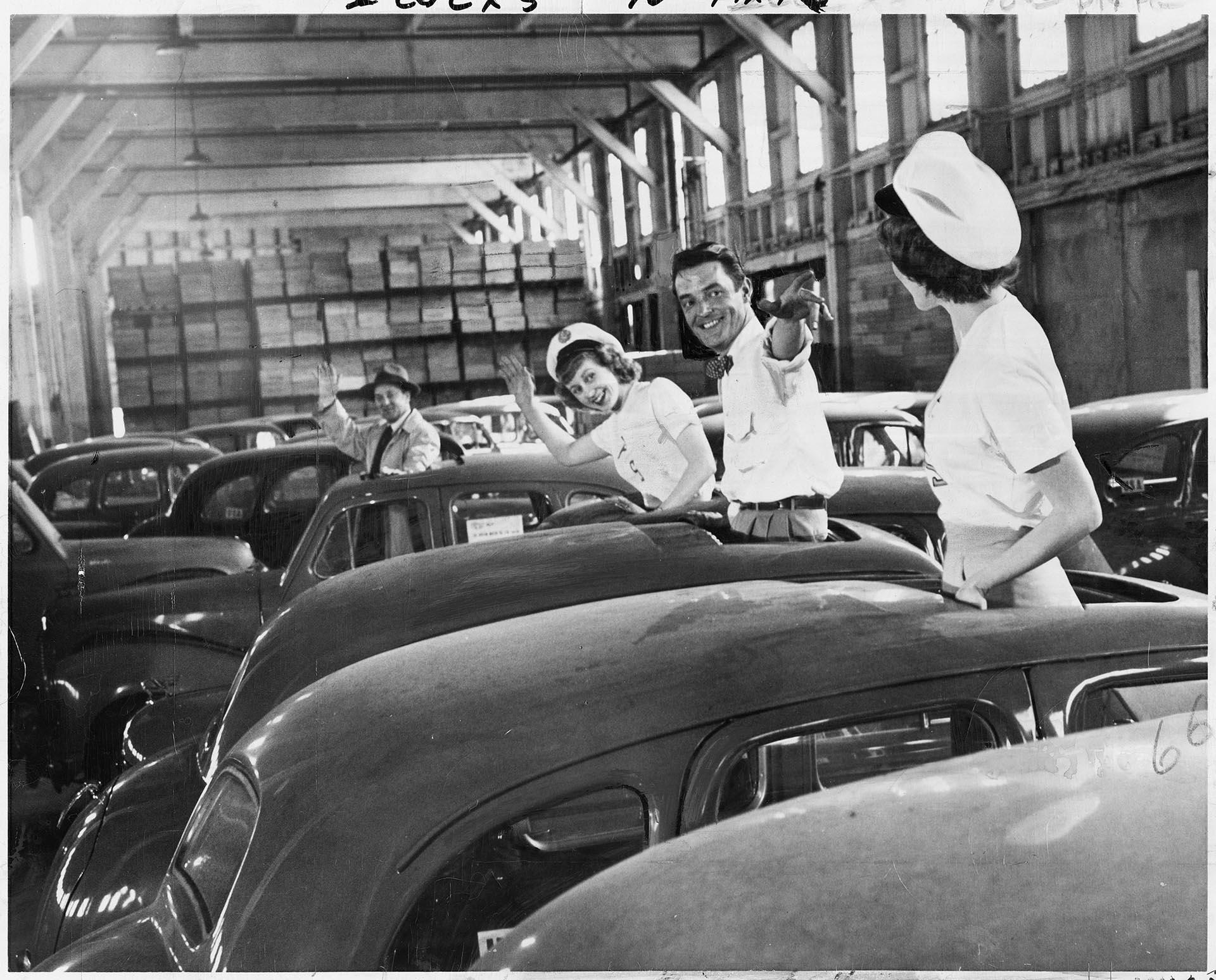 Image of Employees with imported cars at Foreign Trade Zone, Seattle, April 20, 1950
