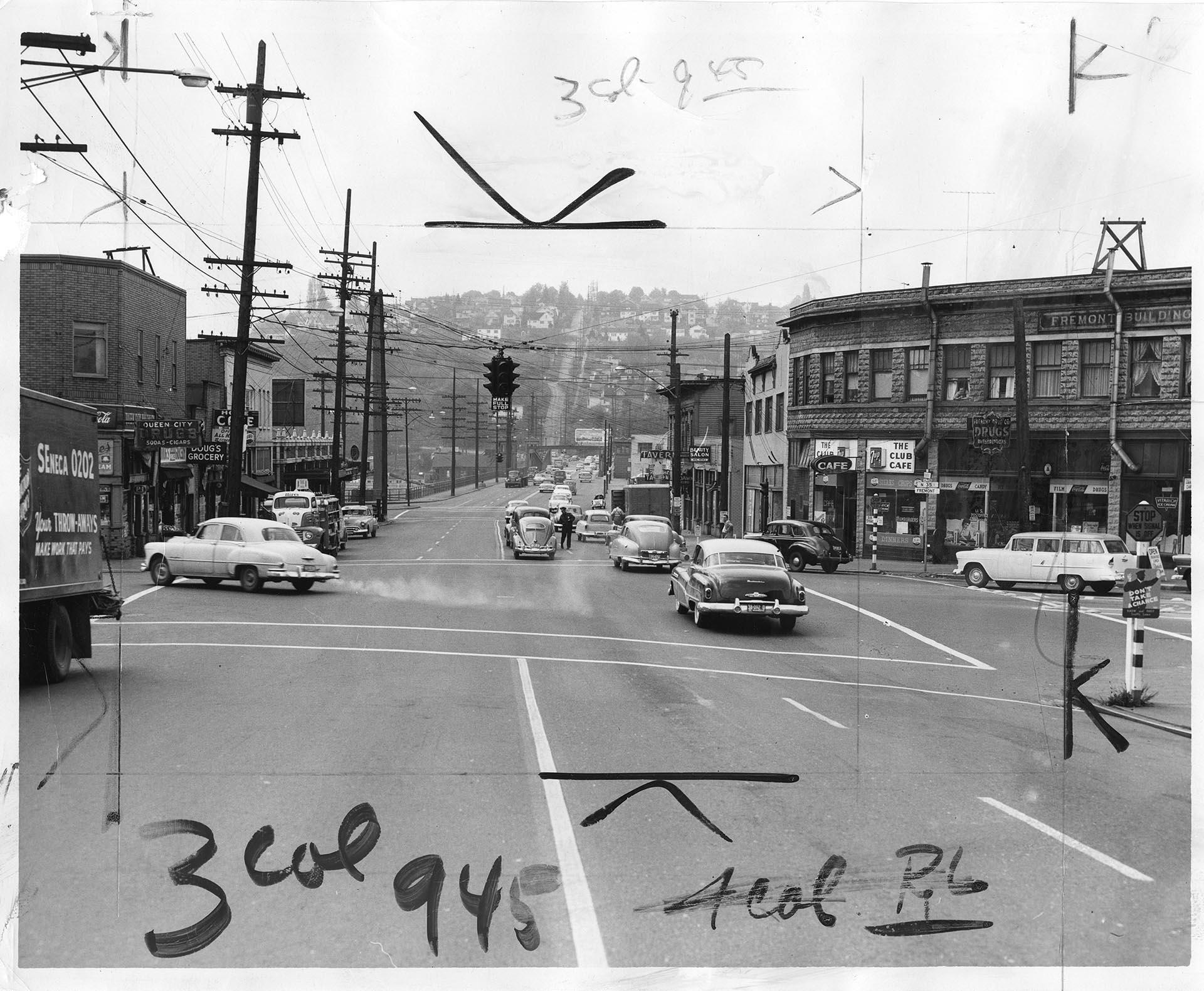 Image of Patrolman handing out Civil Defense evacuation cards, Seattle, May 20, 1955