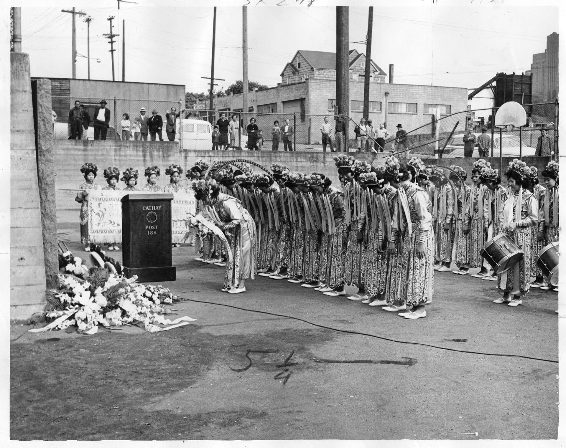 Image of Chinese girls drill team honoring war casualties at memorial ceremony, Seattle, May 30, 1961