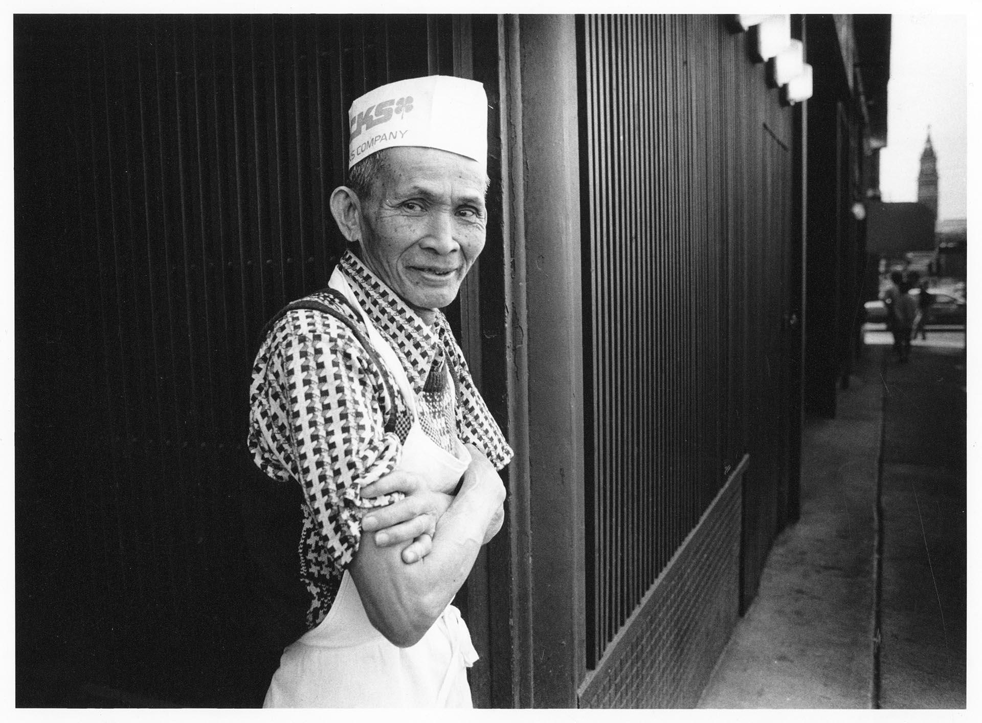 Image of Chinatown - International District restaurant worker taking a break, Seattle, July 8, 1988