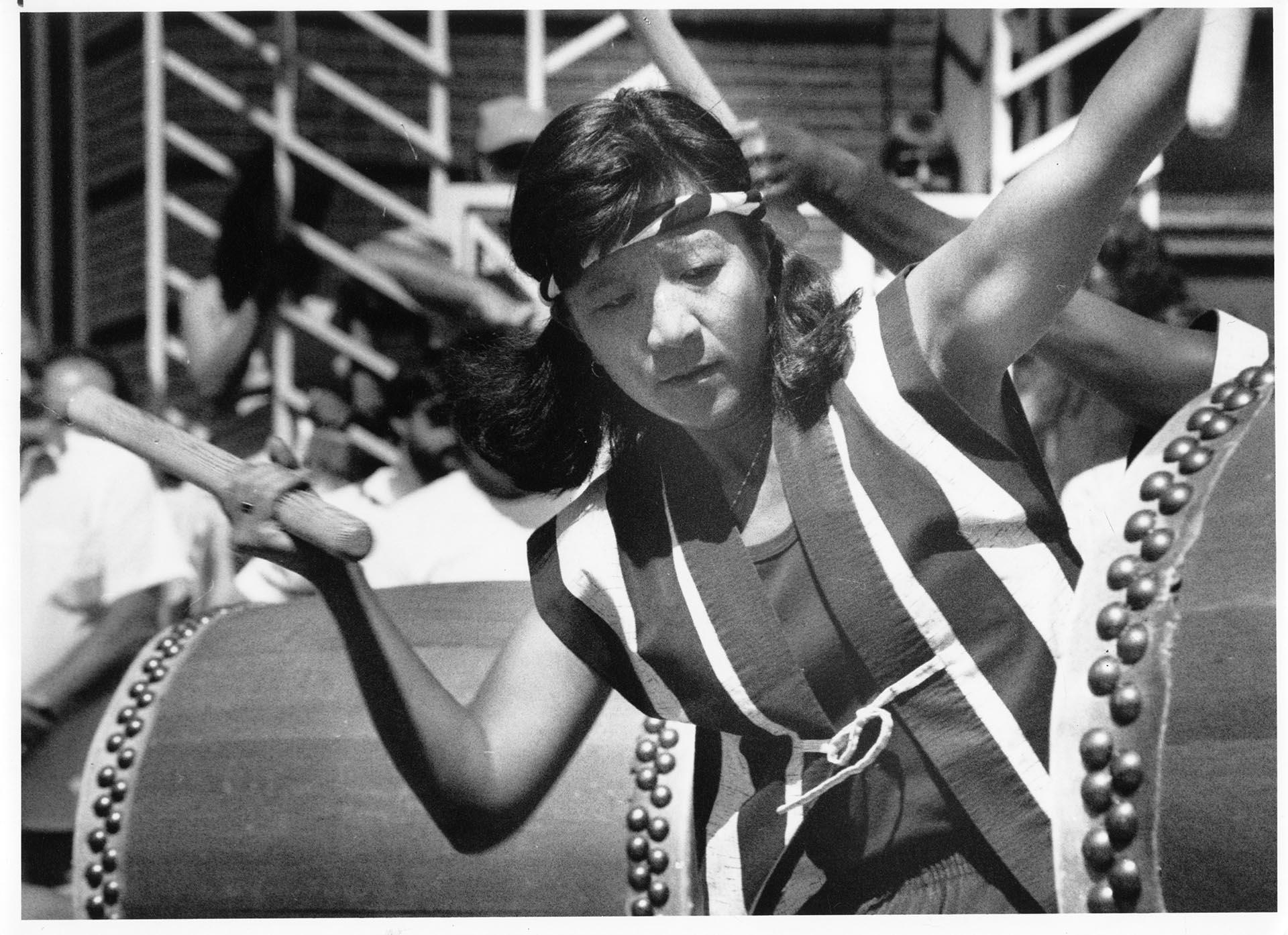 Image of Woman drumming at Chinatown - International District's Summer Festival, Seattle, July 15, 1990