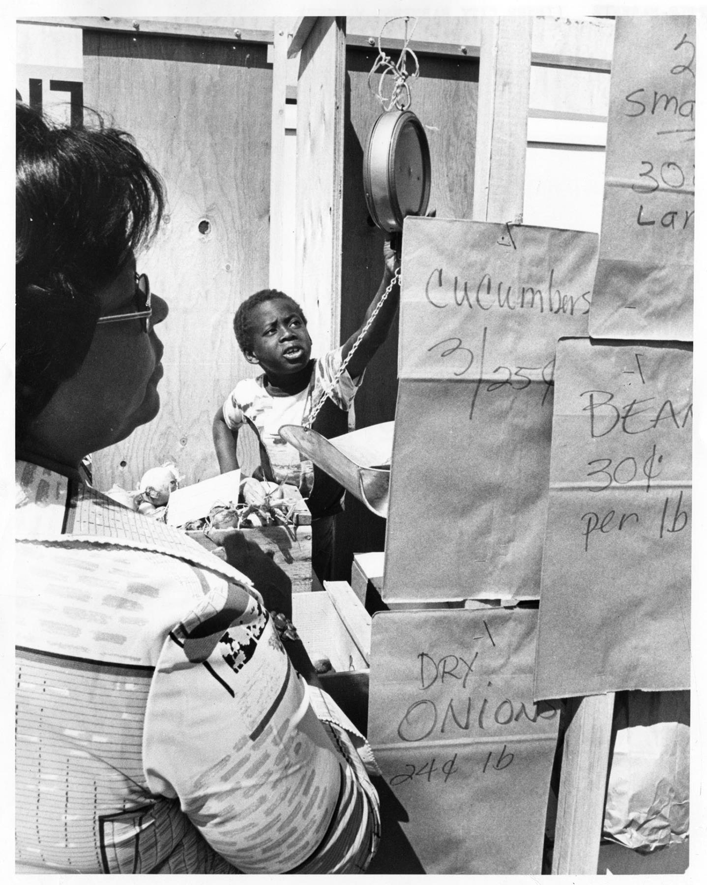 Image of Ray Daniels selling produce at Inner City Market, Seattle, July 31, 1976