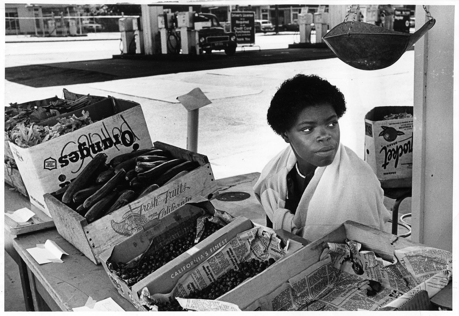 Image of Tina Head staffing stall at Mount Baker farmers market, Seattle, August 3, 1980