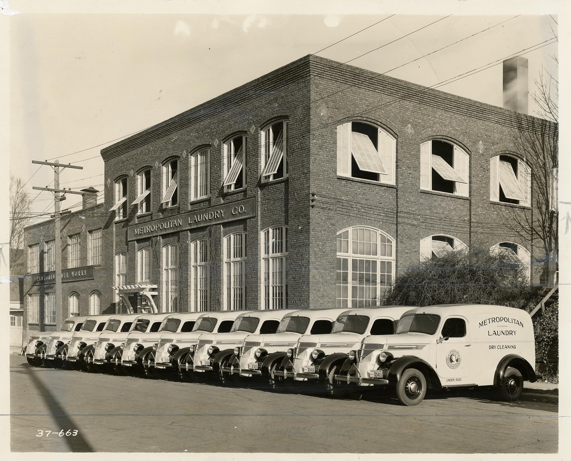 Image of New trucks parked at the Metropolitan Laundry Company, Seattle, January 8, 1938