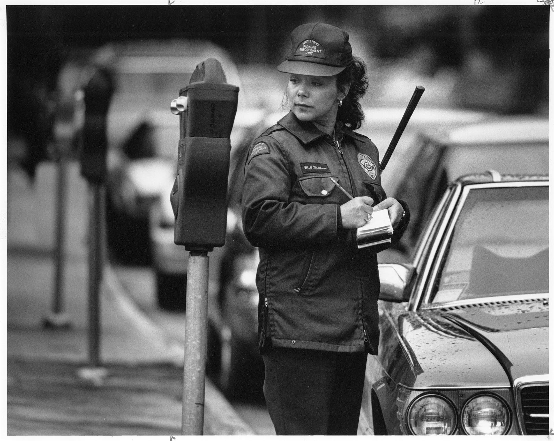 Image of Mariana Matthews writing a parking ticket, Seattle, May 7, 1991