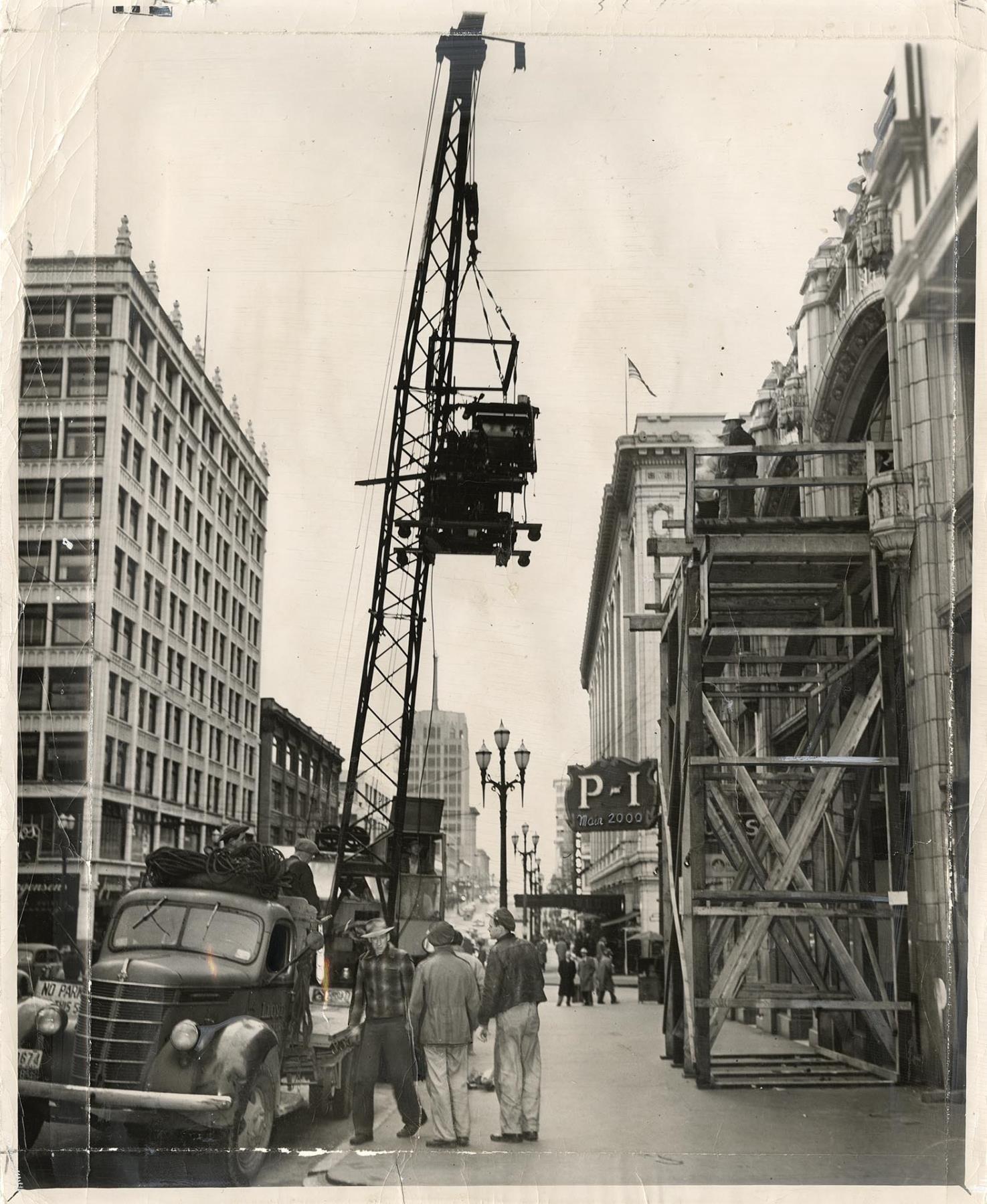 Image of Typesetting machine hanging from crane, Seattle, December 5, 1948