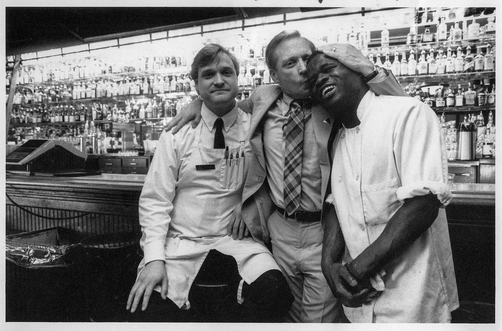 Image of Owner hugging staff at Jake O'Shaughnessy's, Seattle, 1993