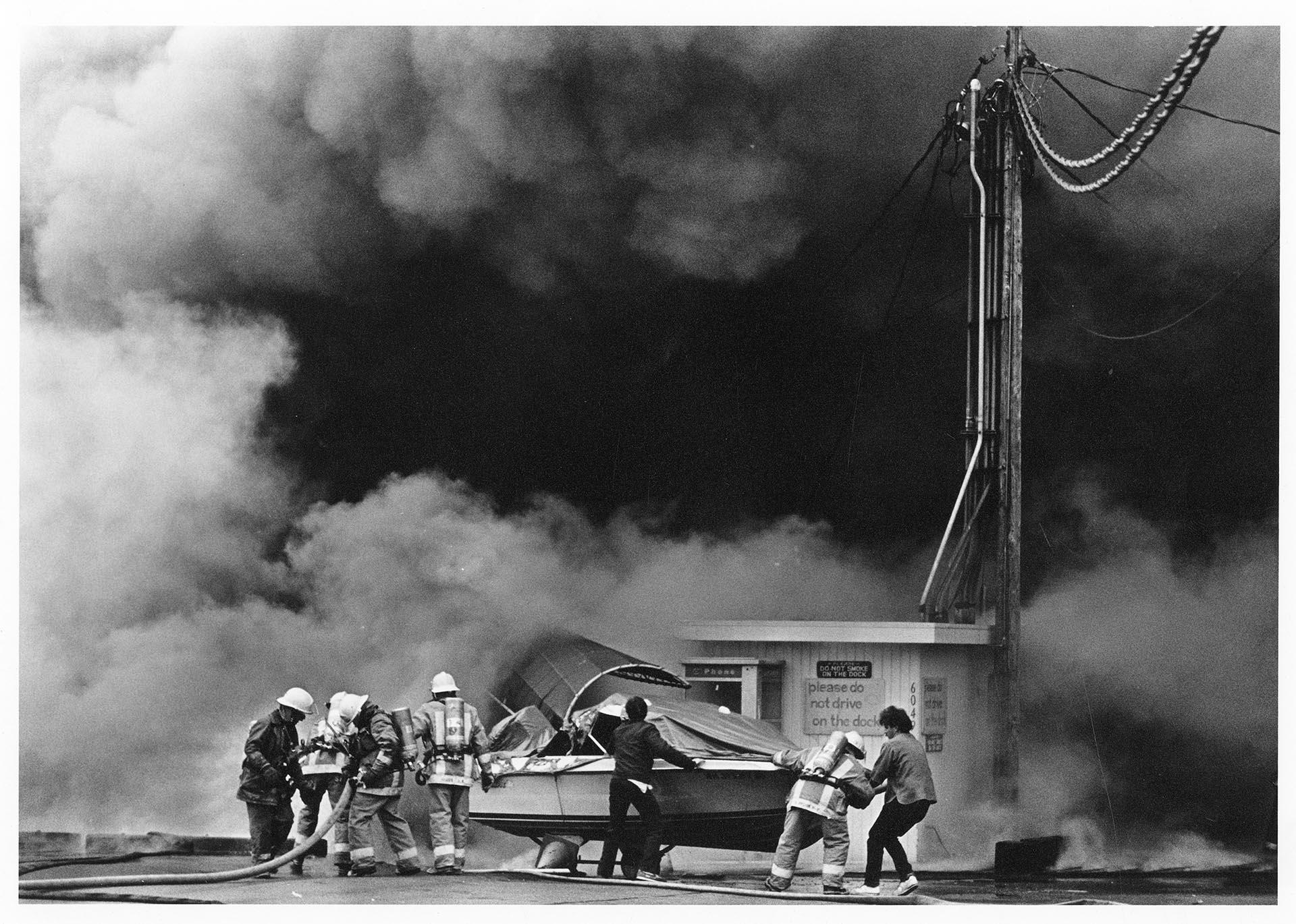 Image of Boat being moved from the fire at Ray's Boathouse, Seattle, May 26, 1987