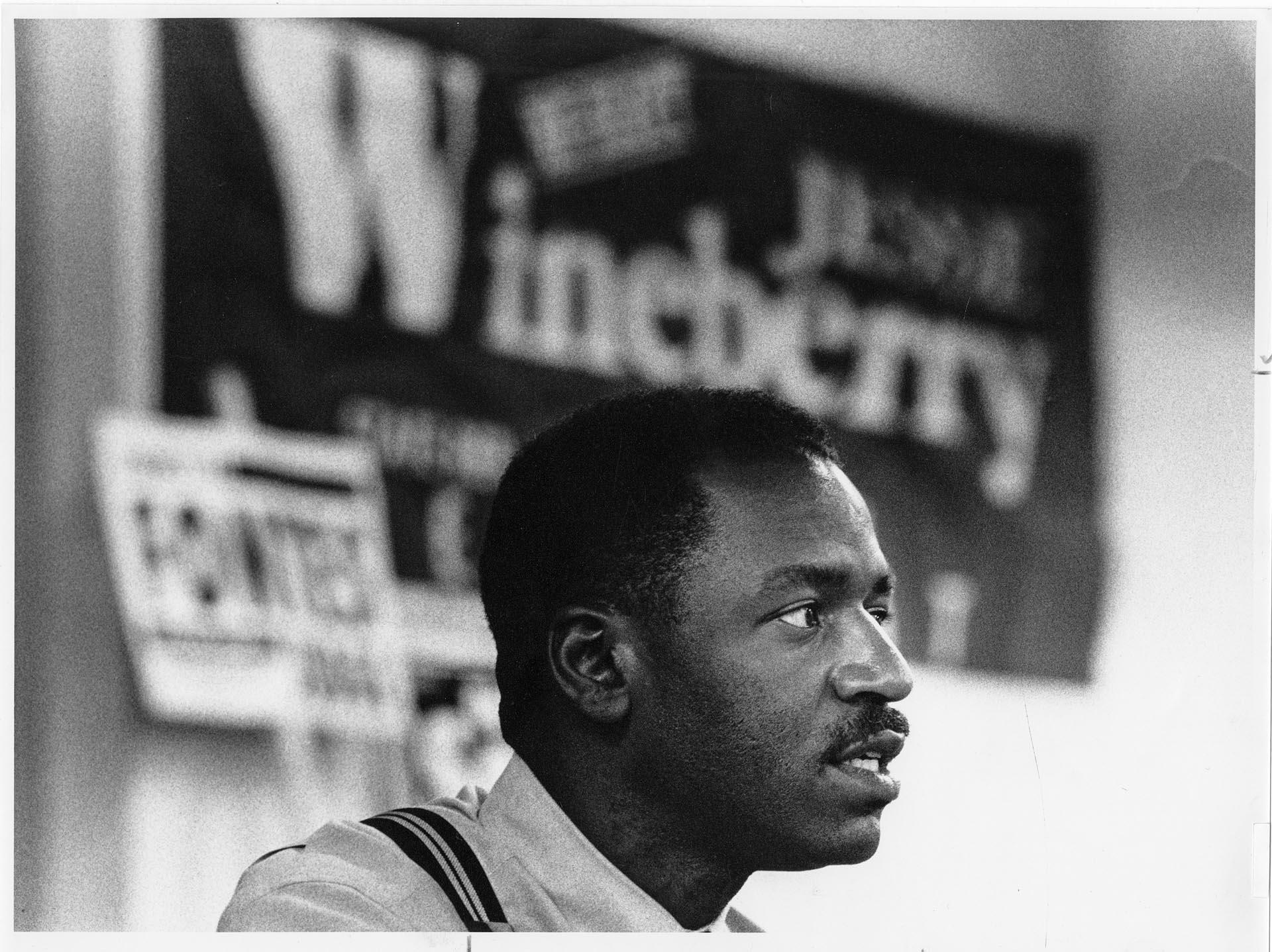 Image of Jesse Wineberry with campaign signs, Seattle, September 2, 1992