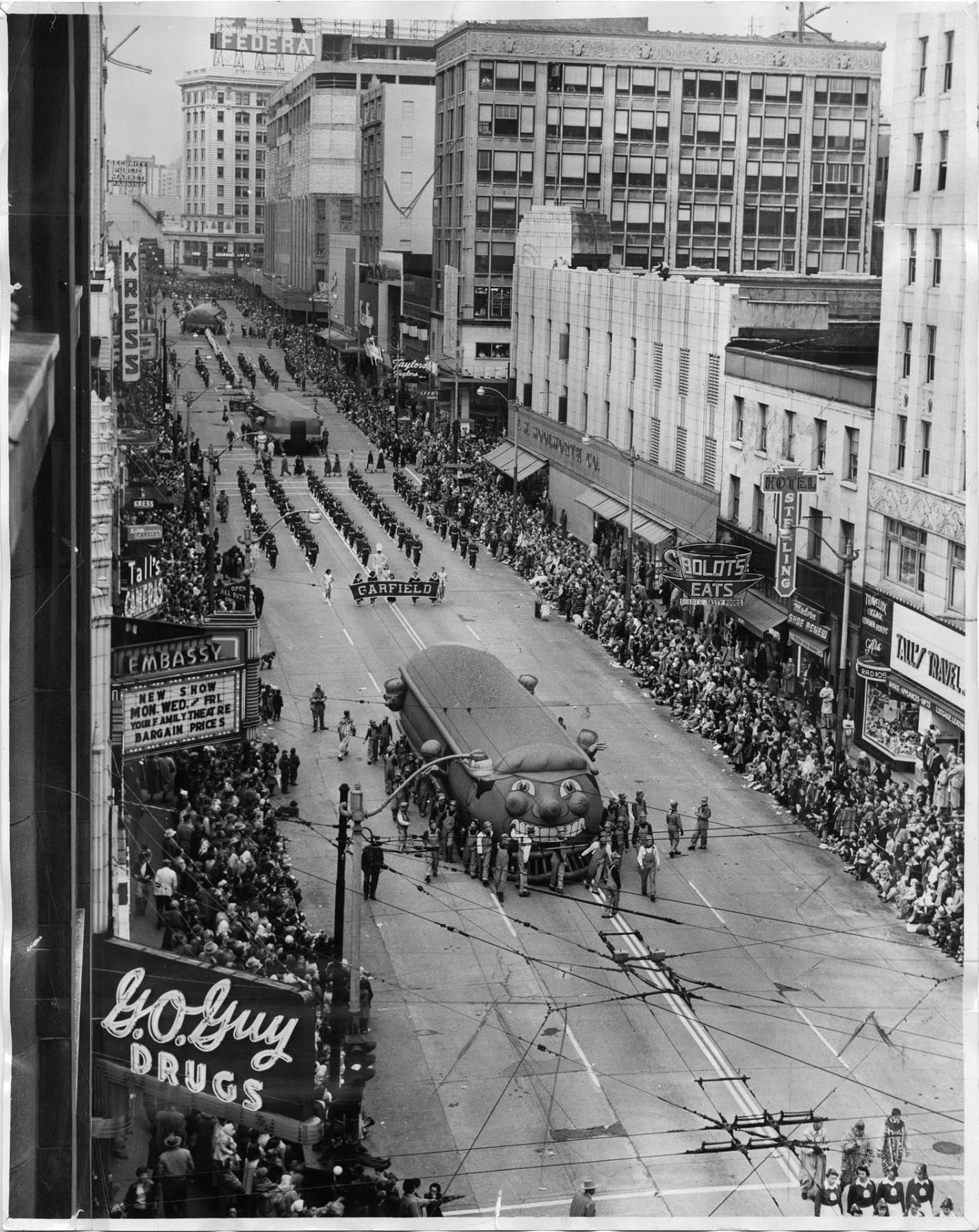Image of Balloon floats parading south on Third Avenue, Seattle, November 20, 1954
