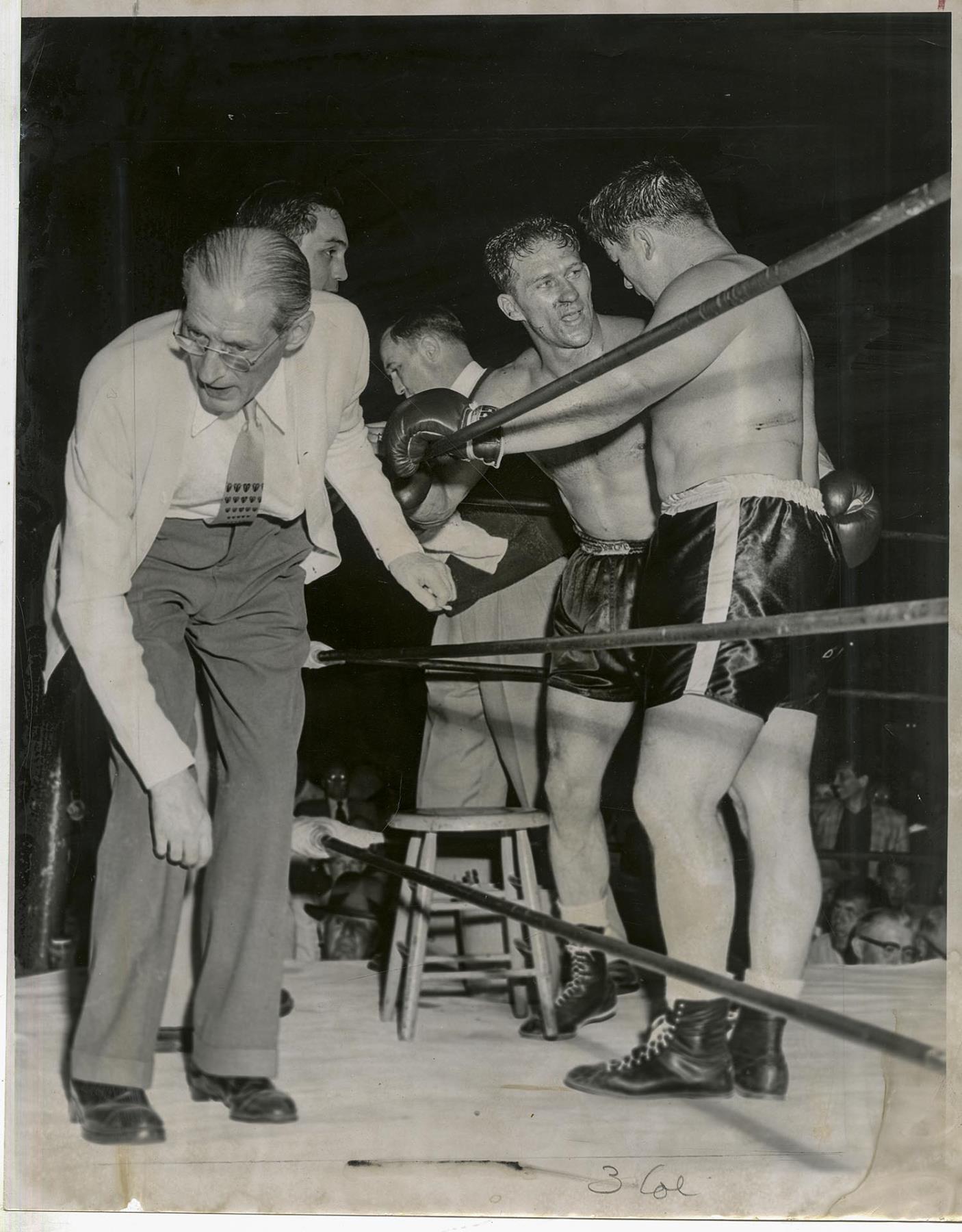 Image of Boxers Harry Matthews and Don Cockell in ring after fight, Seattle, July 30, 1954