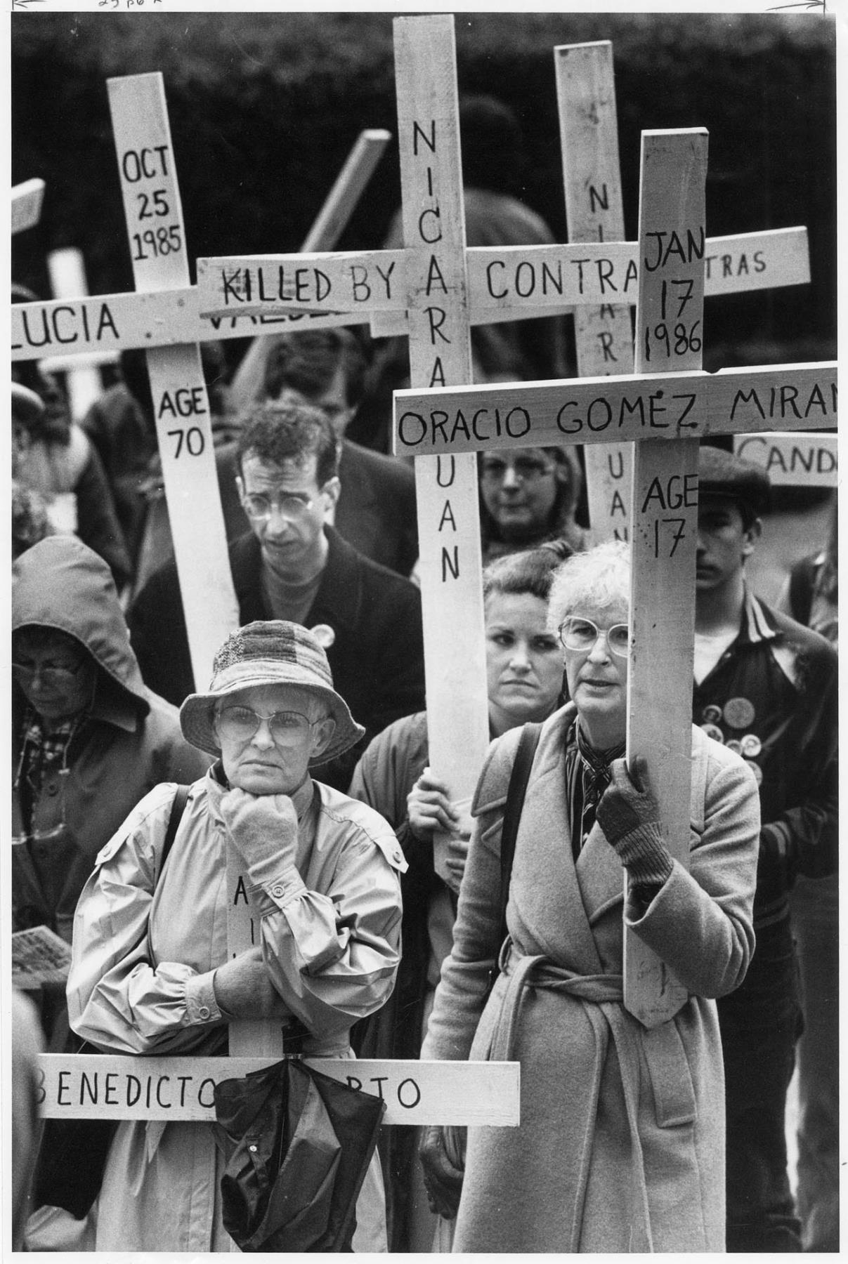 Image of Anti-contra demonstrators holding signs, Seattle, March 3, 1986