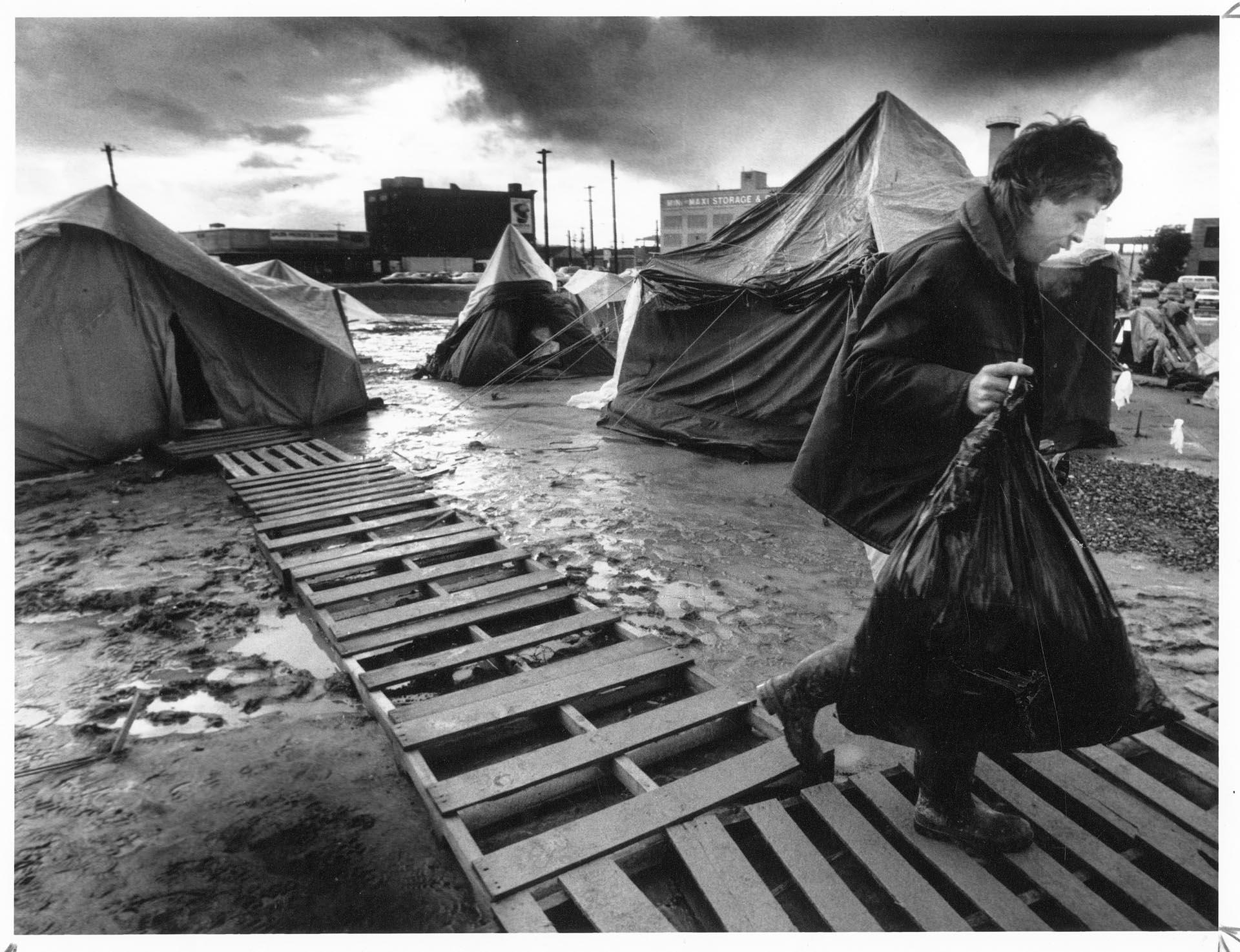 Image of Man removing belongings from Tent City, Seattle, December 10, 1990