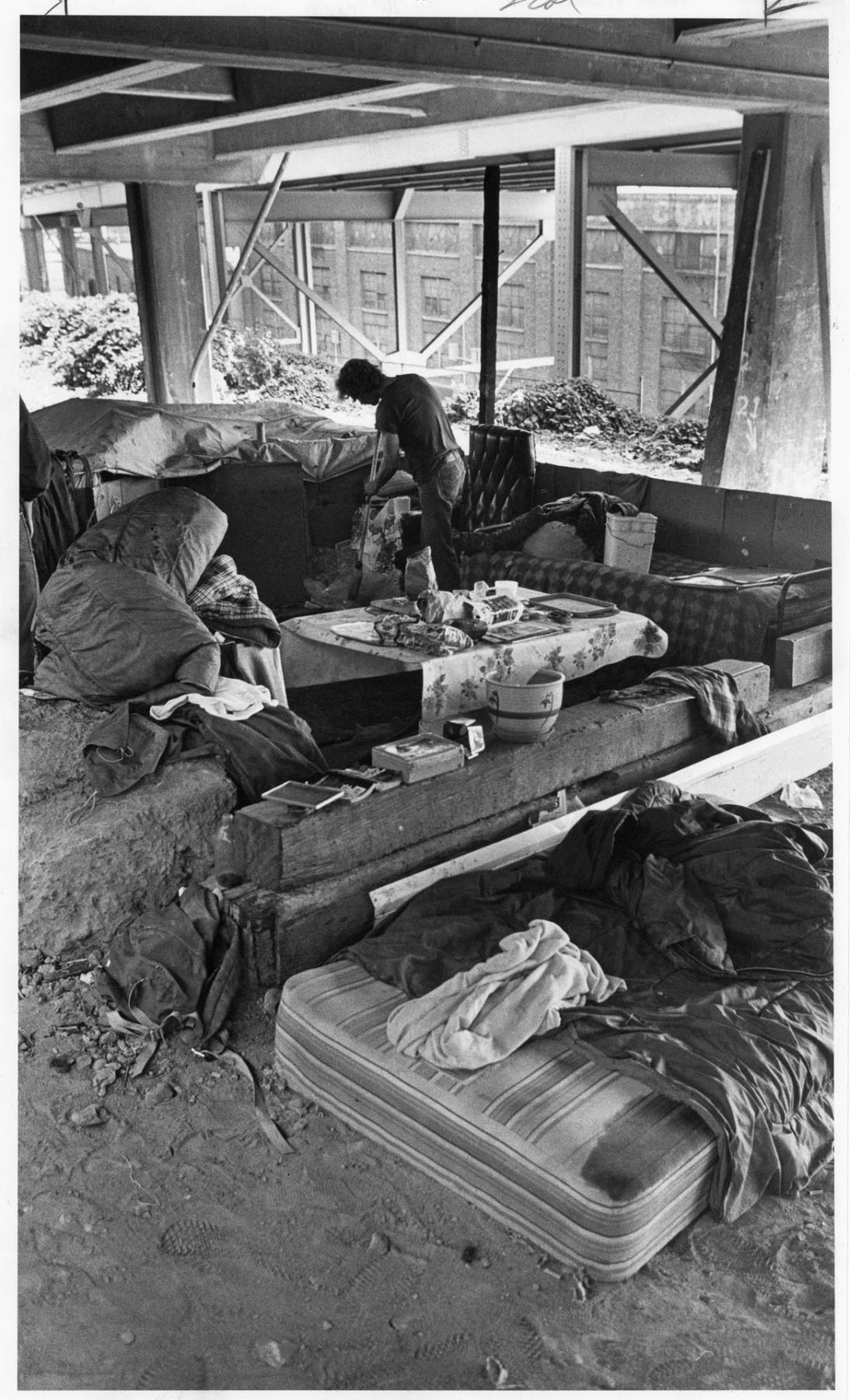 Image of Man cleaning camp under Alaskan Way Viaduct, Seattle, August 21, 1984