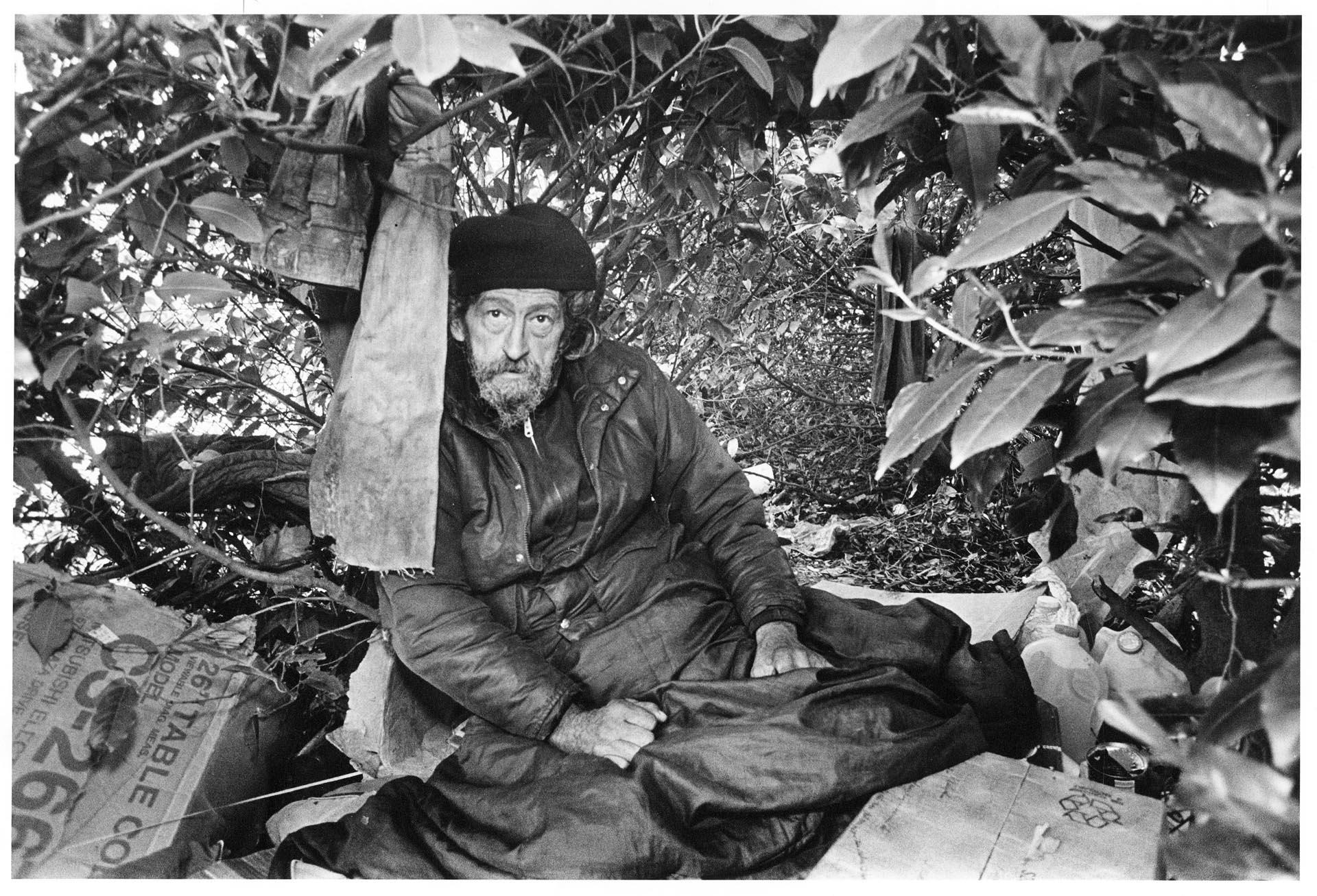 Image of Man sitting in temporary shelter, Seattle, April 16, 1987