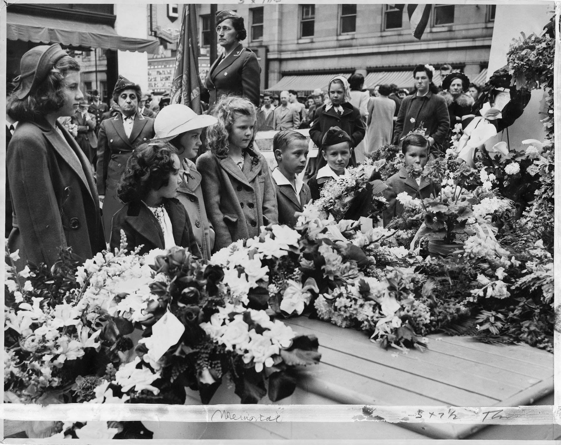 Image of Children placing wreaths on Memorial Day, Seattle, May 30, 1945