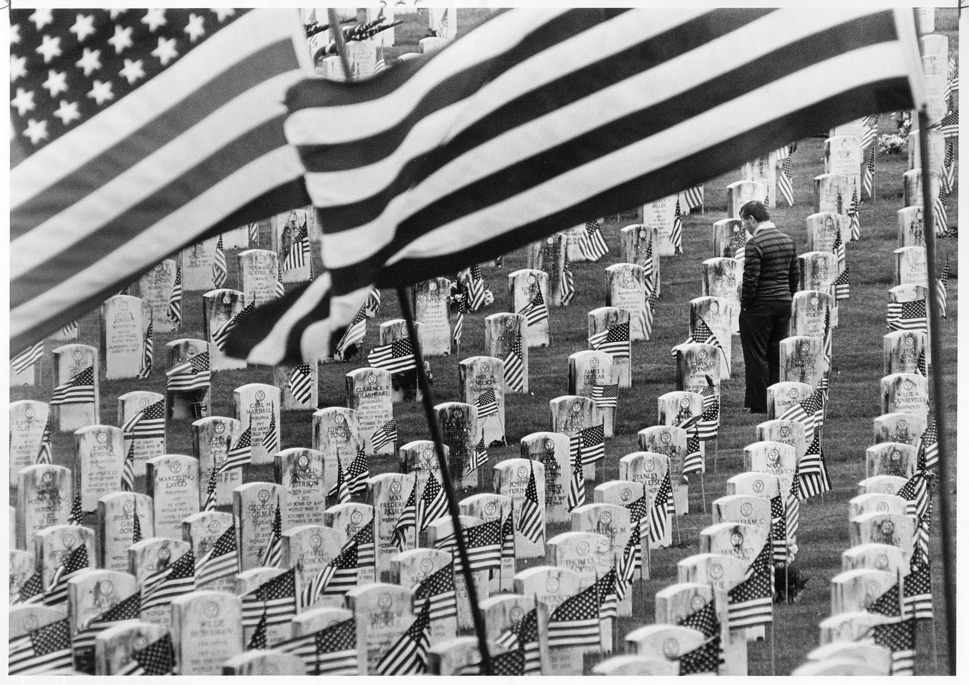 Image of Man at cemetery observing Memorial Day, Seattle, May 27, 1985