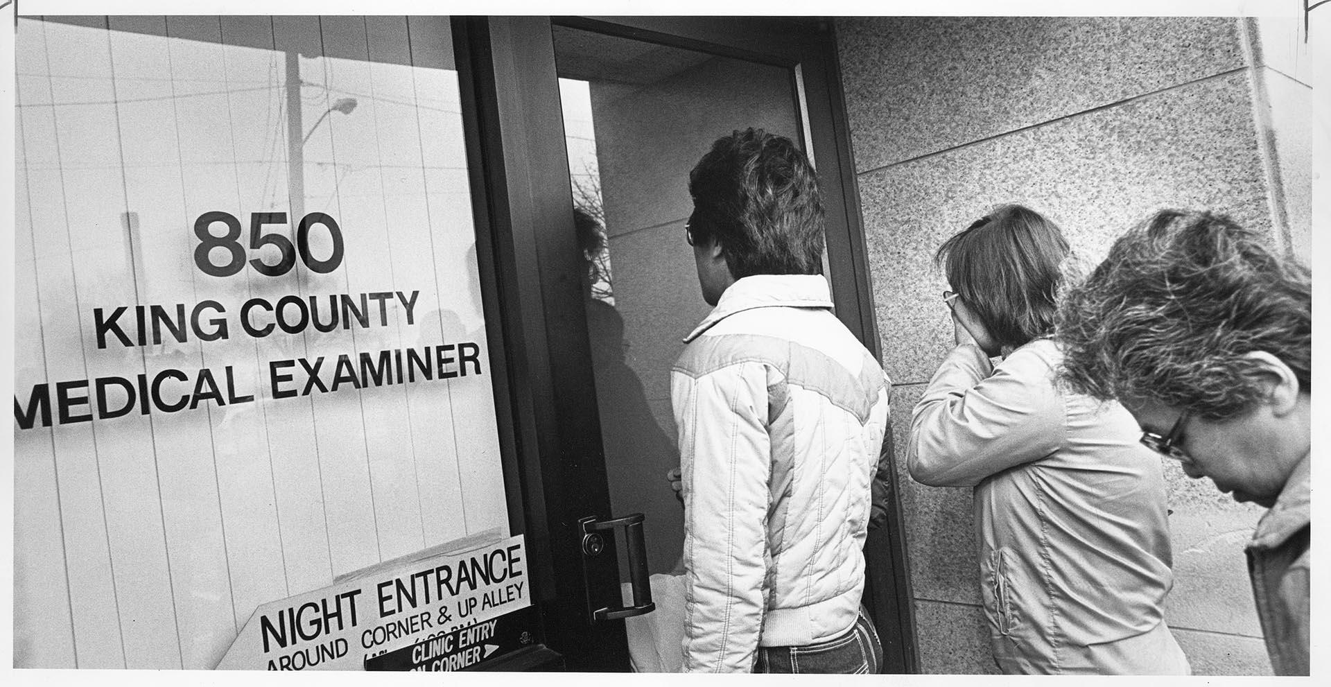 Image of Family seeking information on victims of Wah Mee Club massacre, Seattle, February 20, 1983