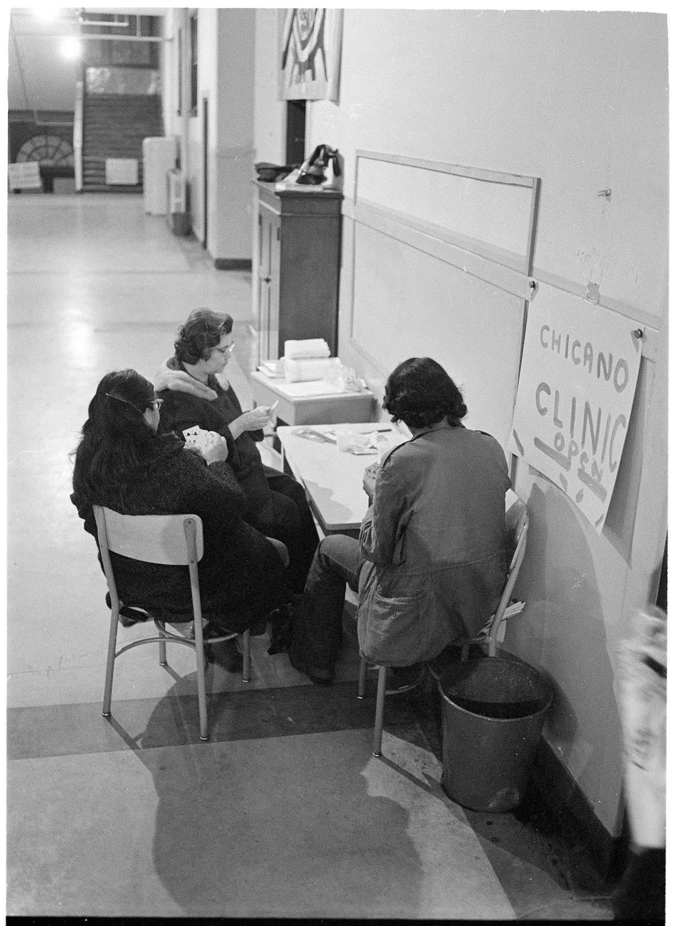Image of Three people playing cards during Beacon Hill School occupation, October 18, 1972